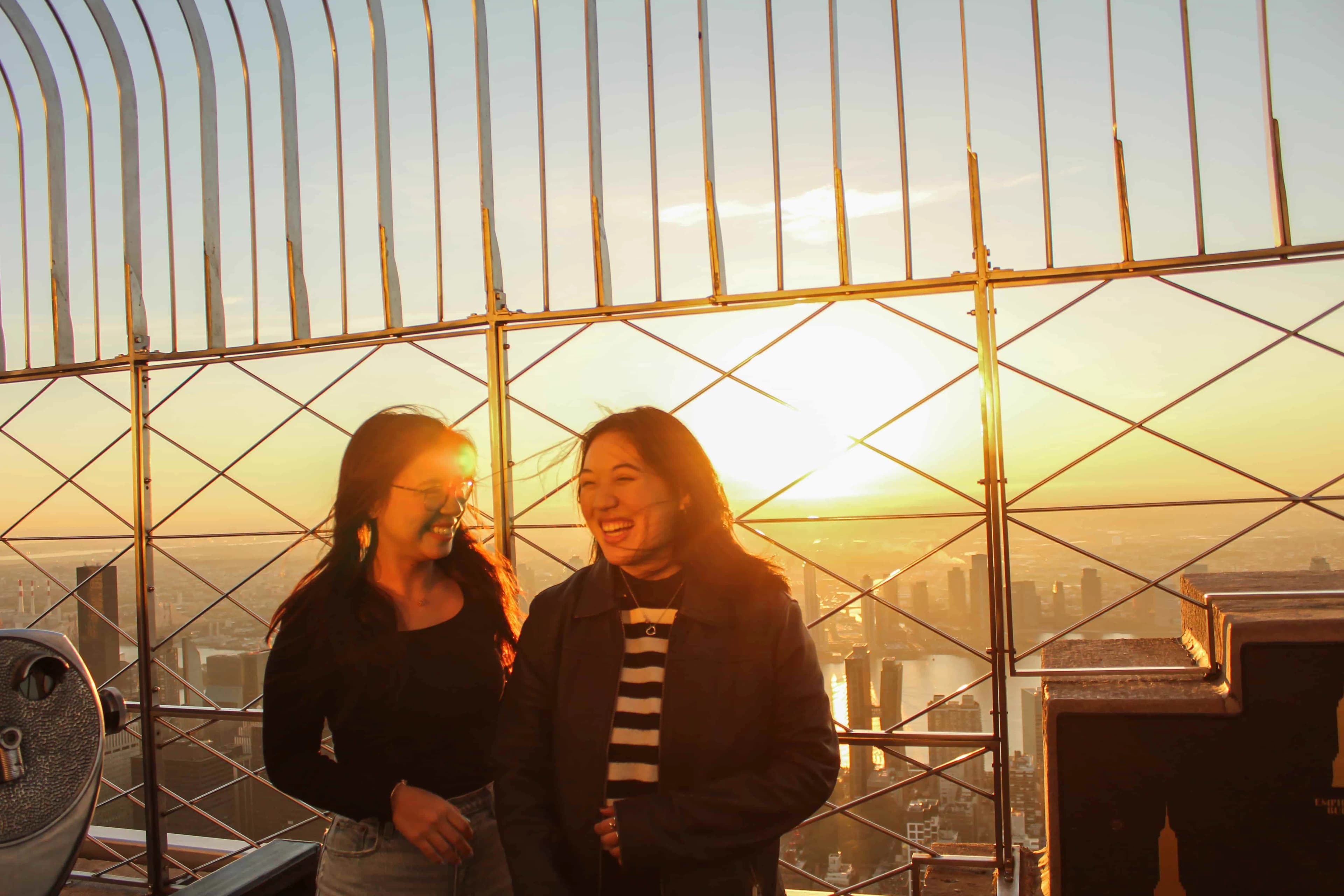Girls enjoying the sunrise views at the Empire State Building
