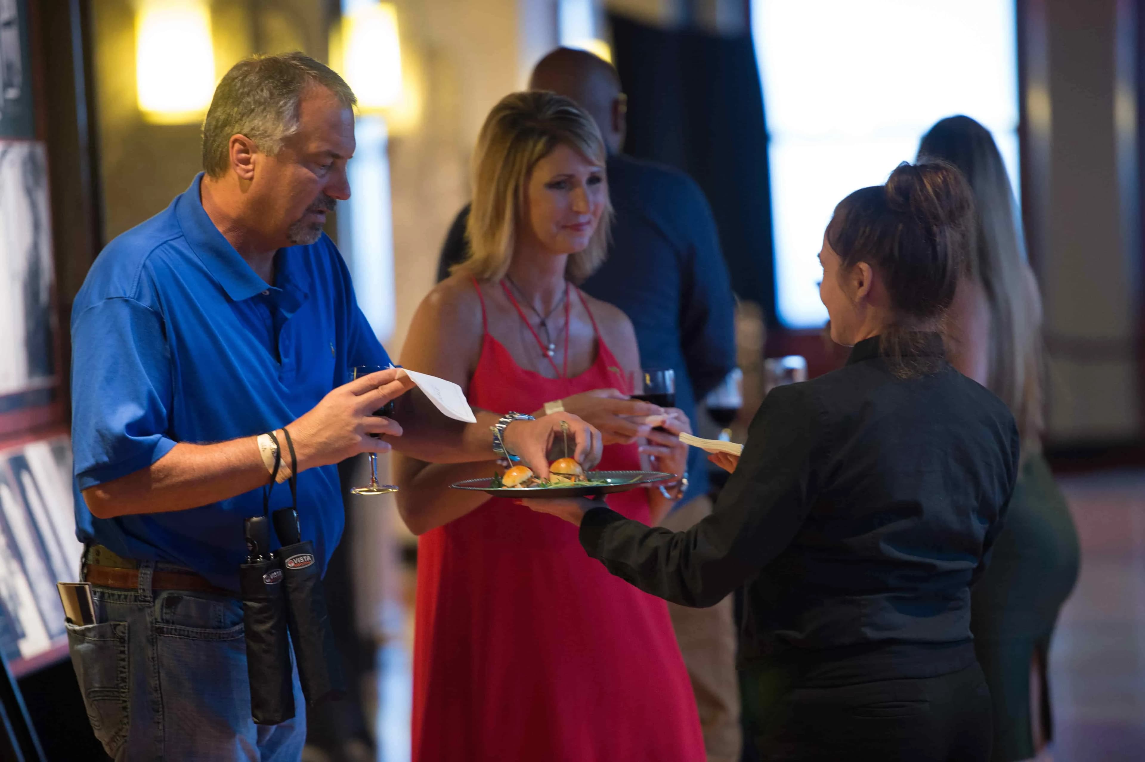 Couple enjoying food & beverages at the Empire State Building's Fourth of July celebration