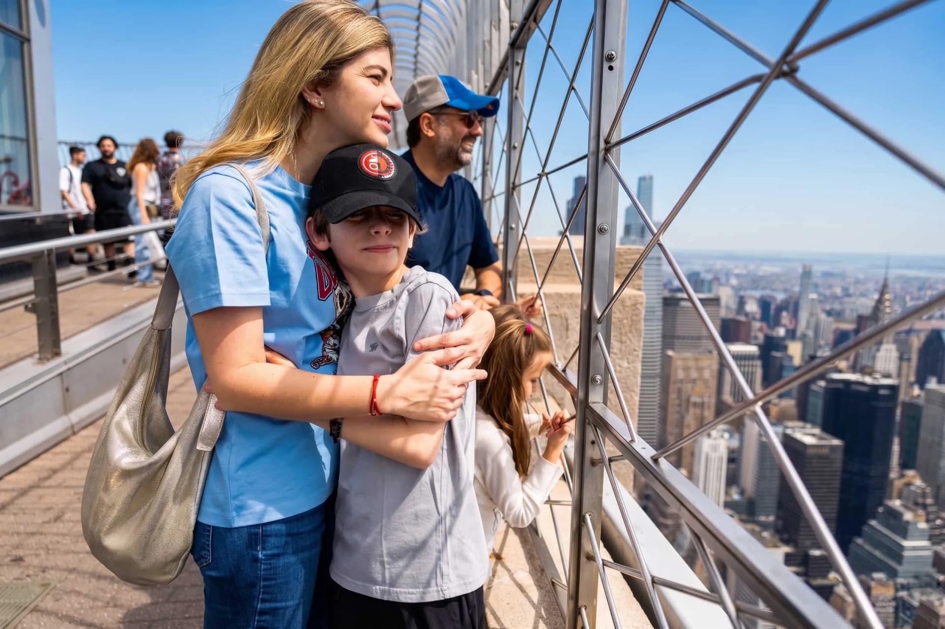 People looking out at the Empire State Building's 86th Floor Observation Deck