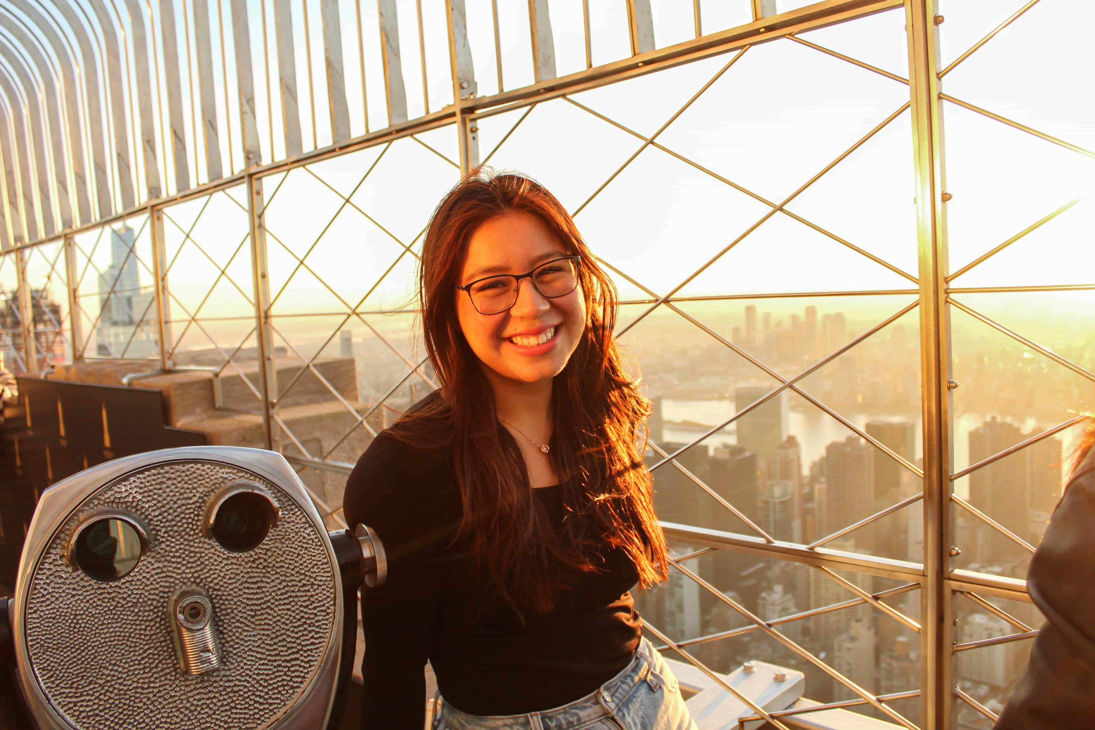 Girl enjoying the sunrise views at the Empire State Building