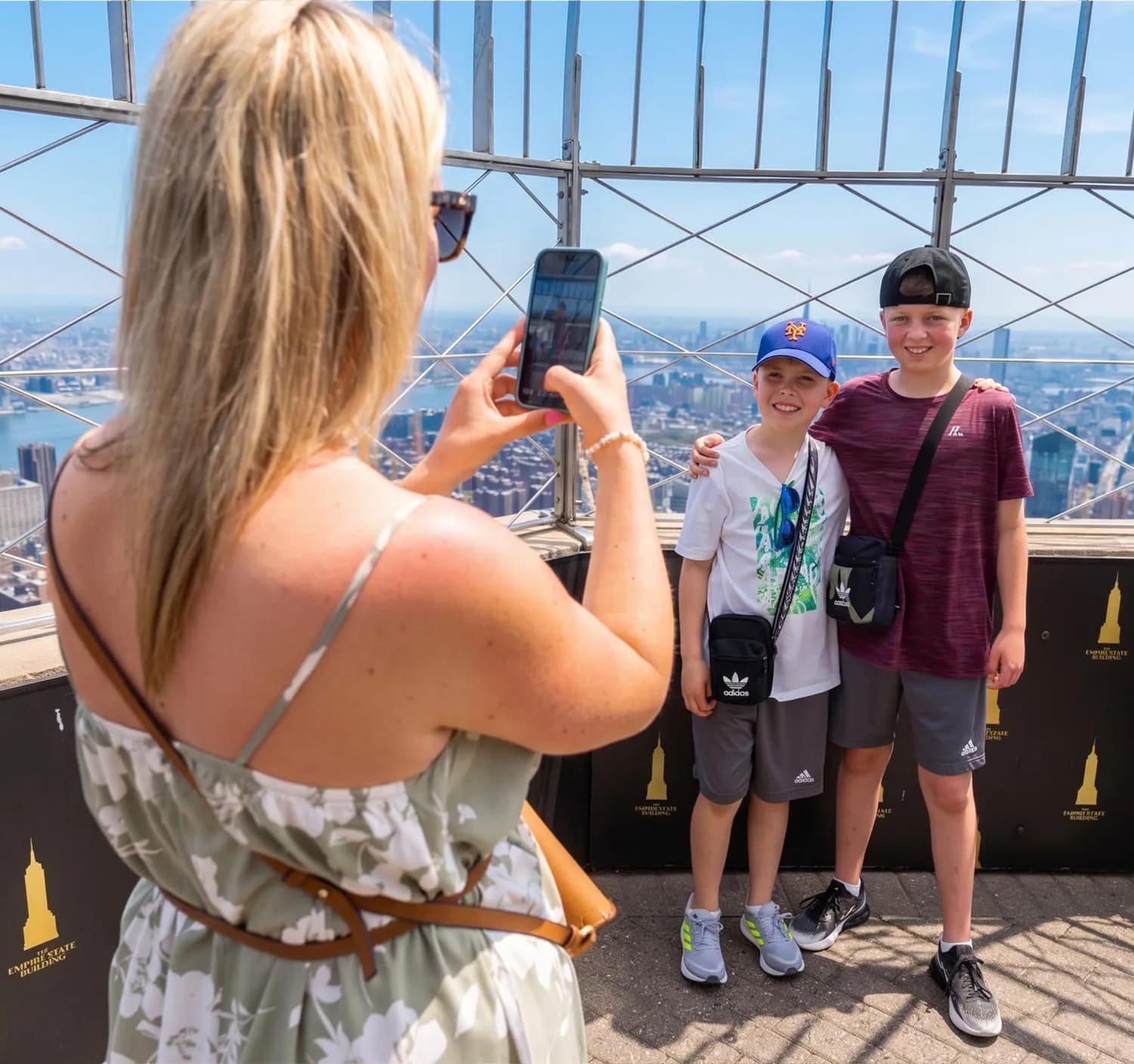 Family taking photo with NYC views in the background