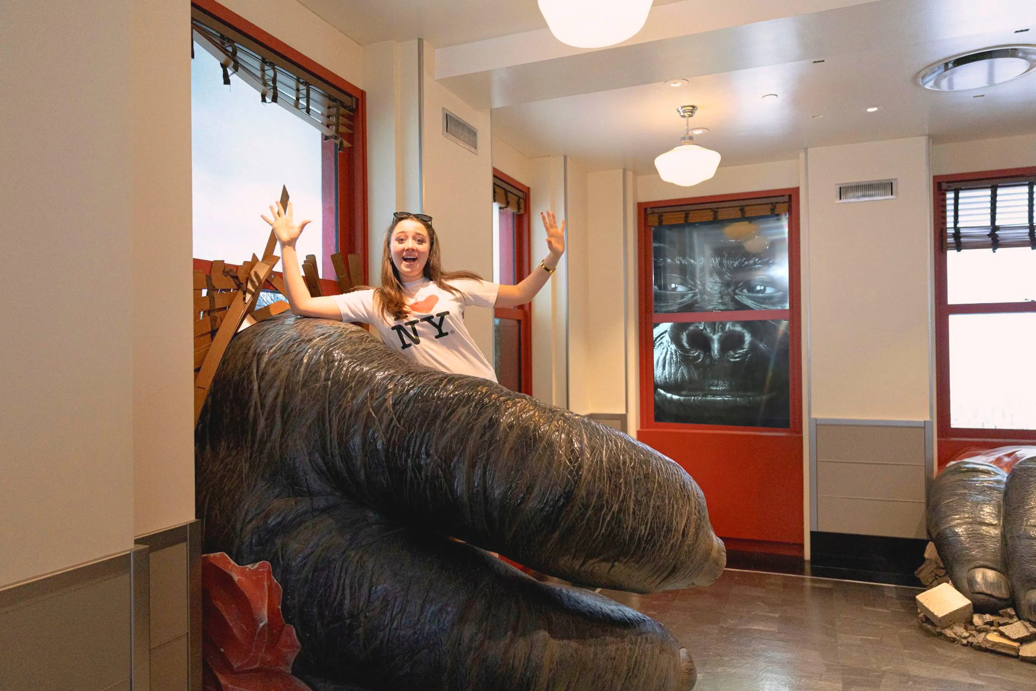 Girl at the Empire State Building's Kong Exhibit