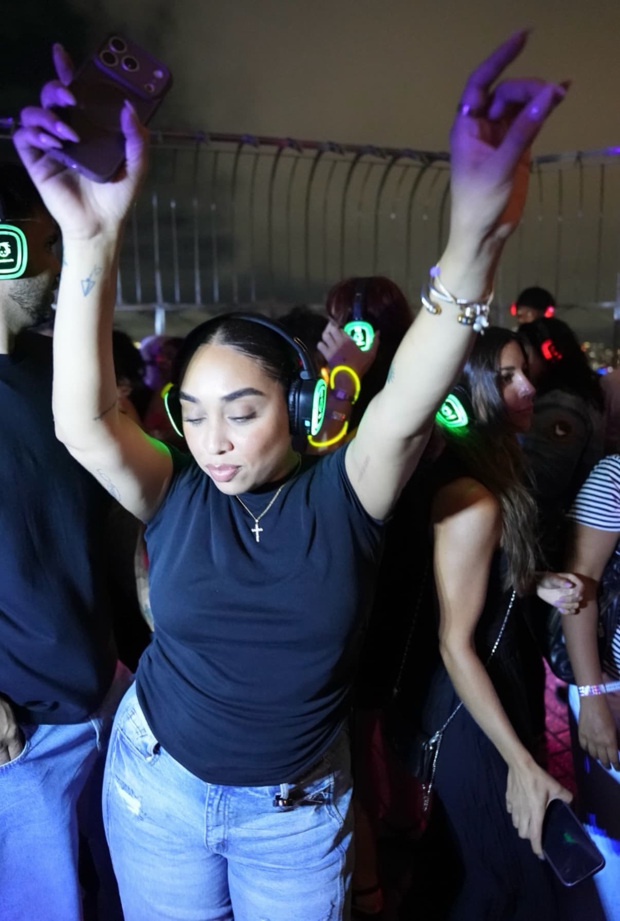 Girl dancing at the Empire State Building Observation Deck Silent Disco Night