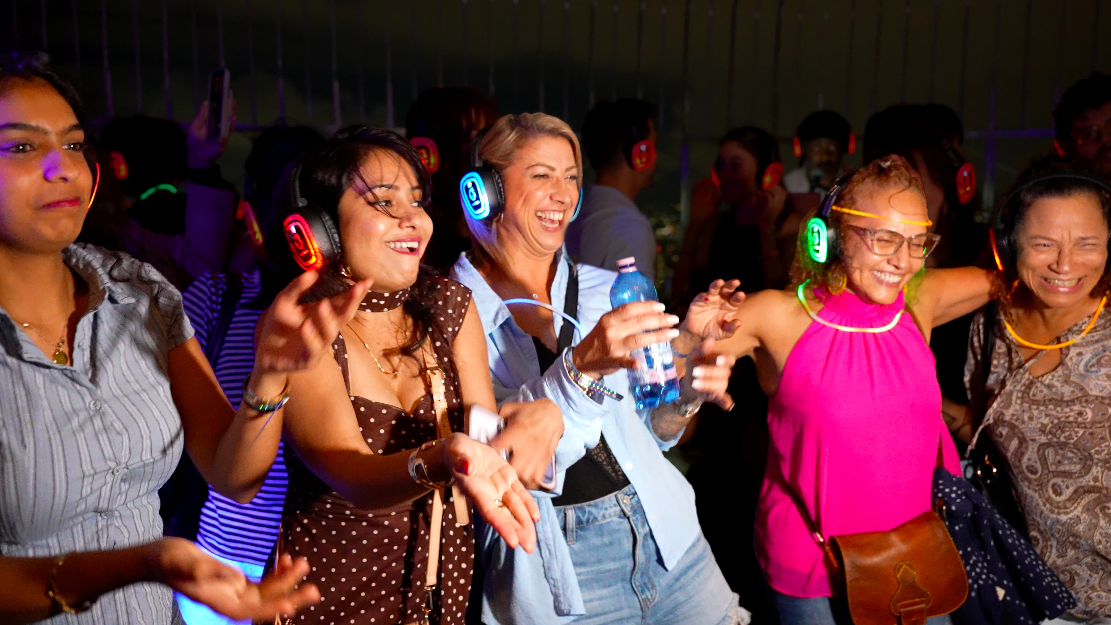 People dancing on the 86th Floor Observation Deck during NYC Silent Disco Night