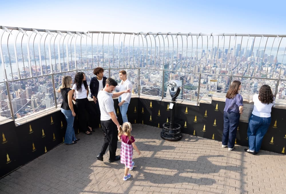 Father and daughter walking through the 86th Floor Observation Deck