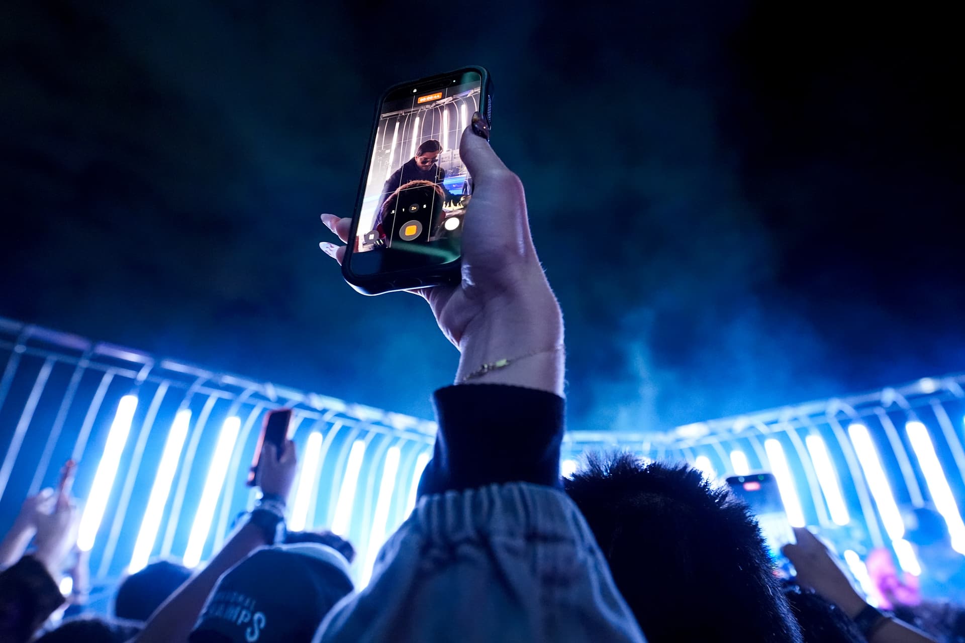 A fan records the Alesso performance at the Empire State Building