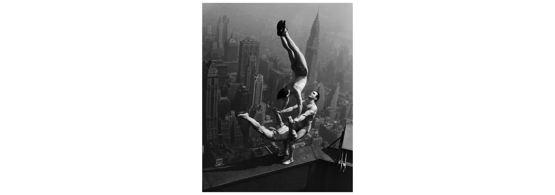 Acrobats balance on the top of ESB