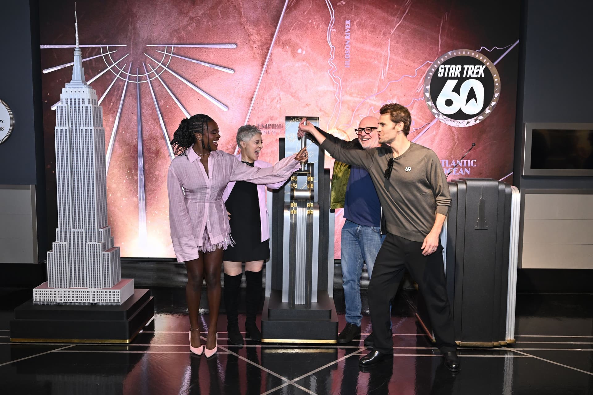 Paul Wesley, Celia Rose Gooding, Melissa Navia, and Akiva Goldsman light the Empire State Building