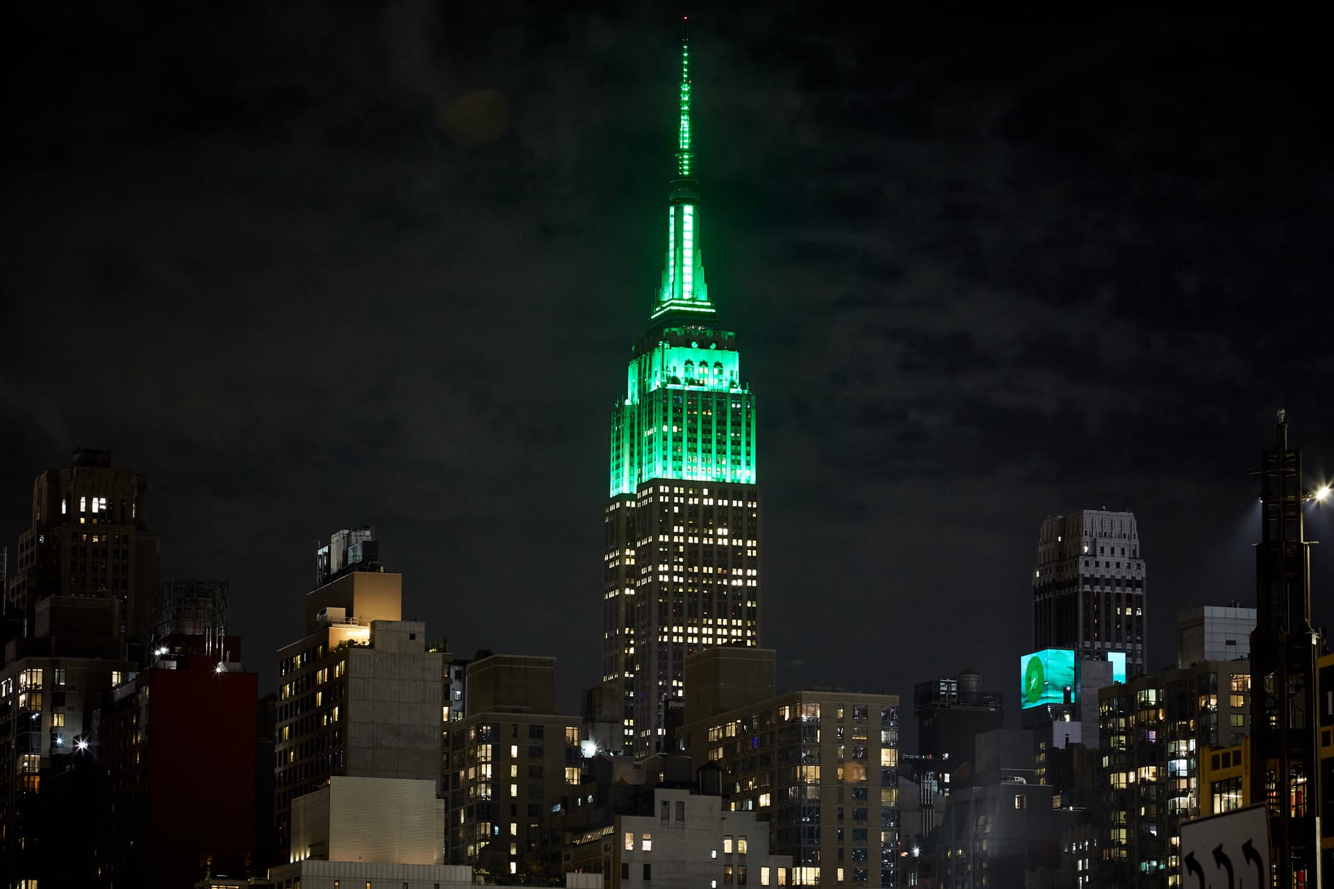 The Empire State Building lit in green