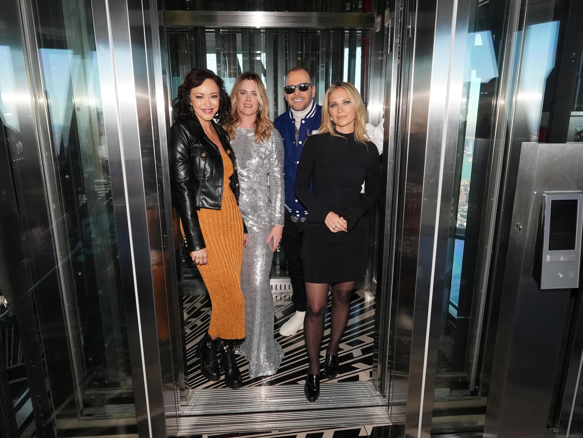 The cast of "Blue Bloods" poses in the mast car