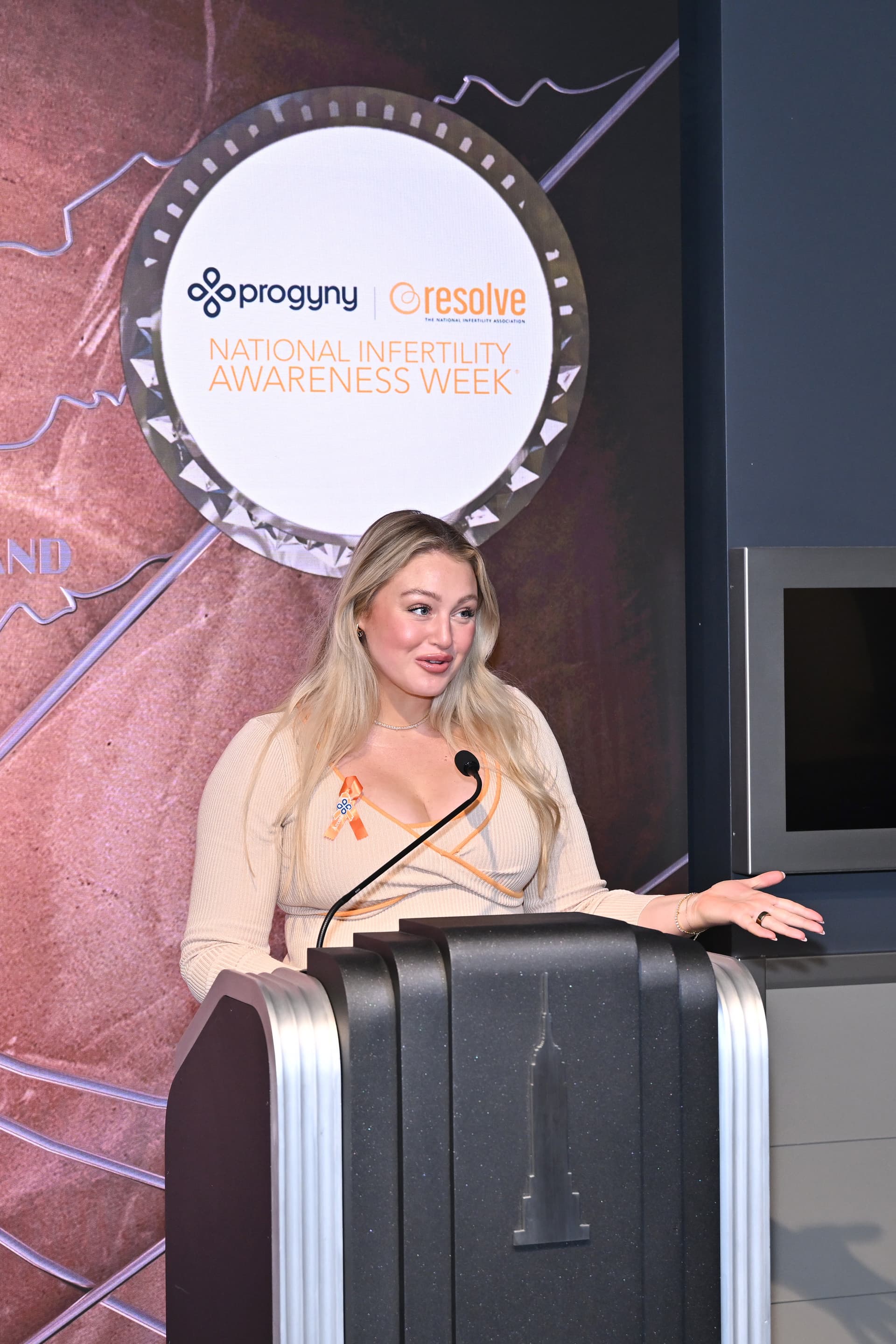 Iskra Lawrence speaks at the lighting ceremony