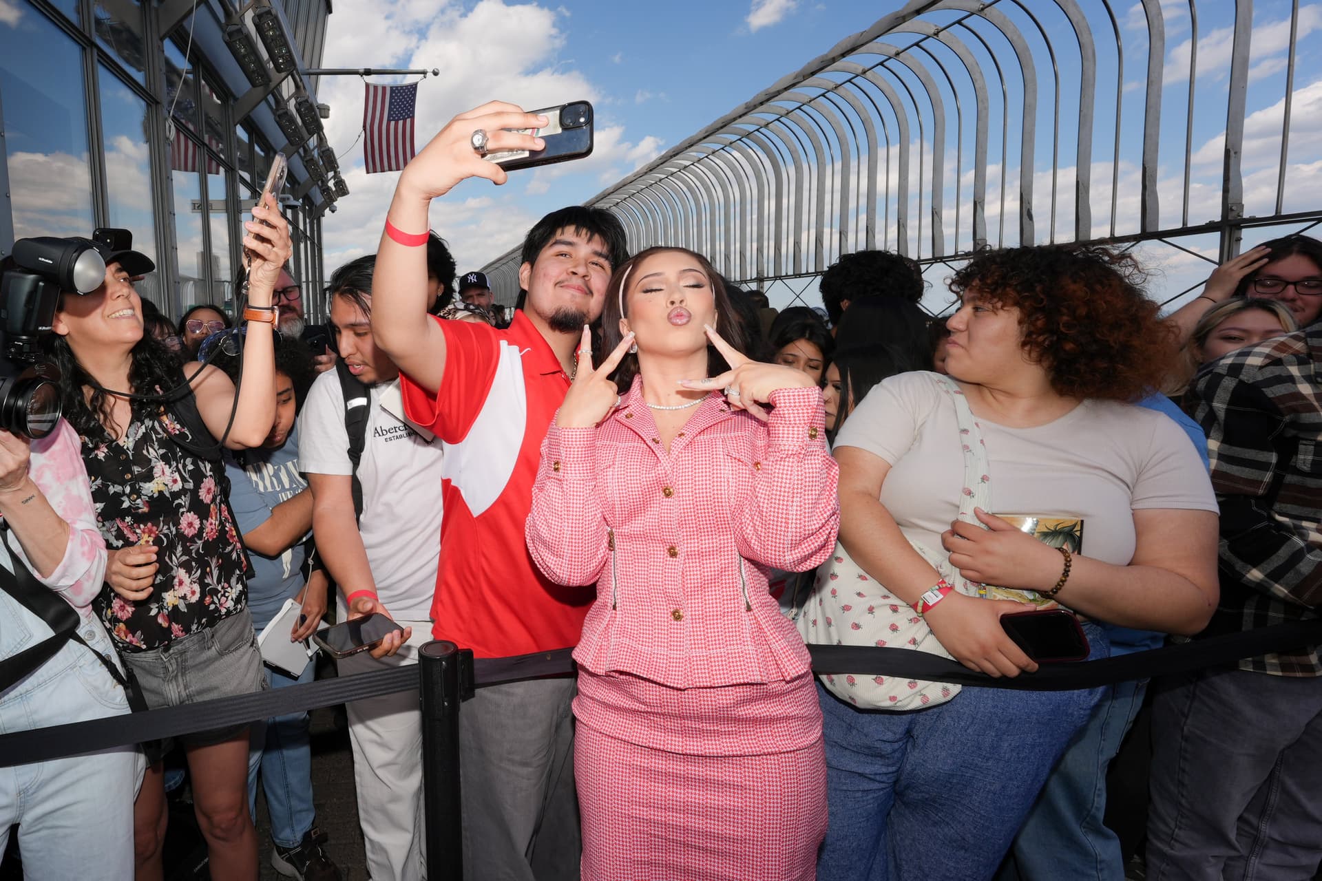 Kali Uchis poses with fans on the 86th Floor Observatory
