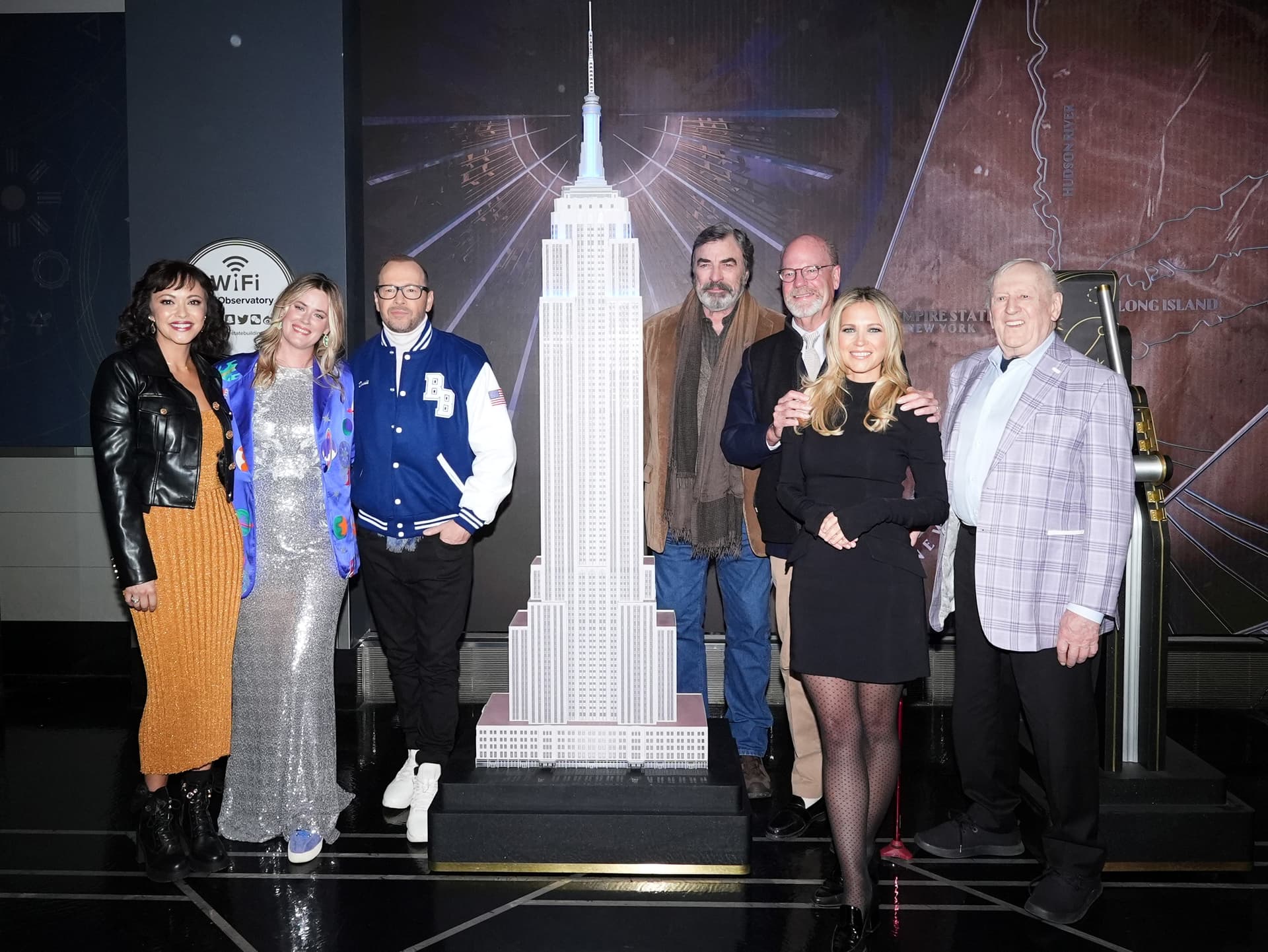 The cast of "Blue Bloods" poses with the small ESB model