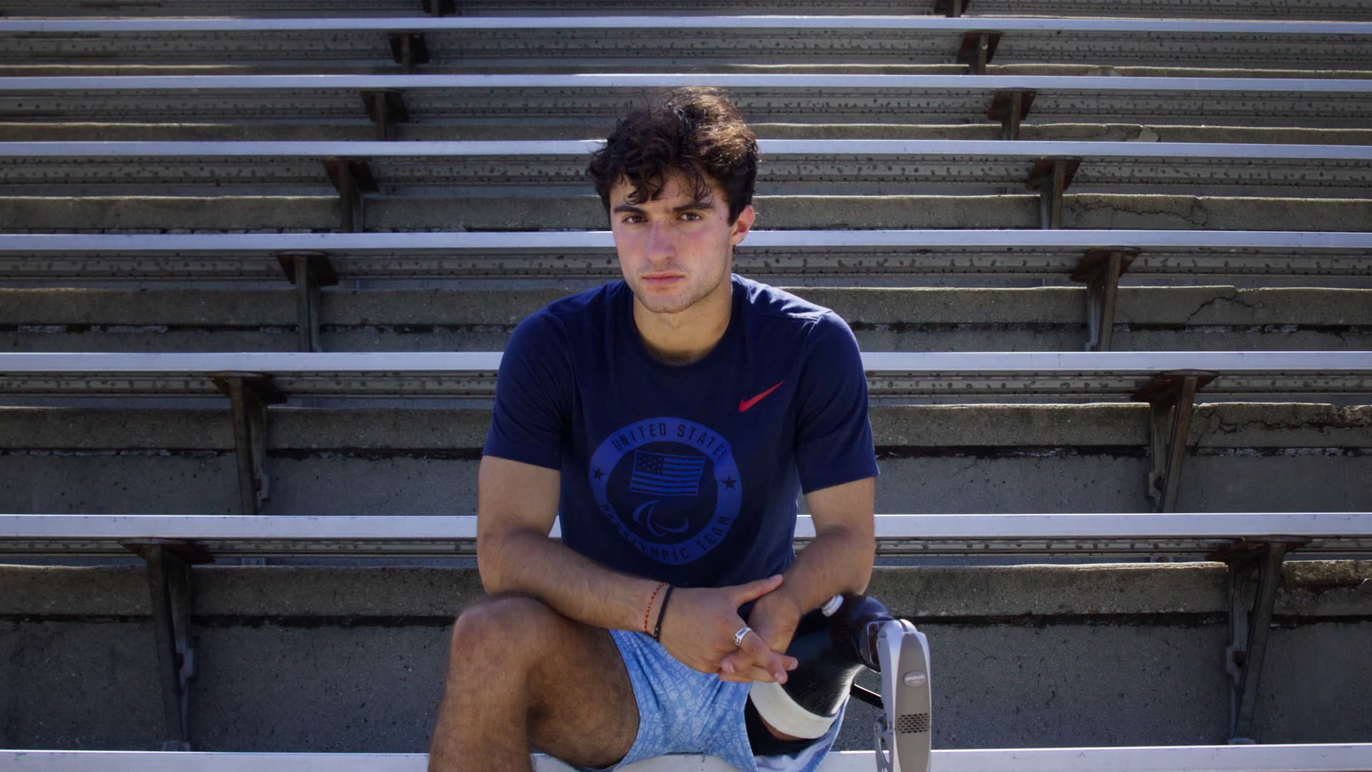 Ezra Frech poses on bleachers