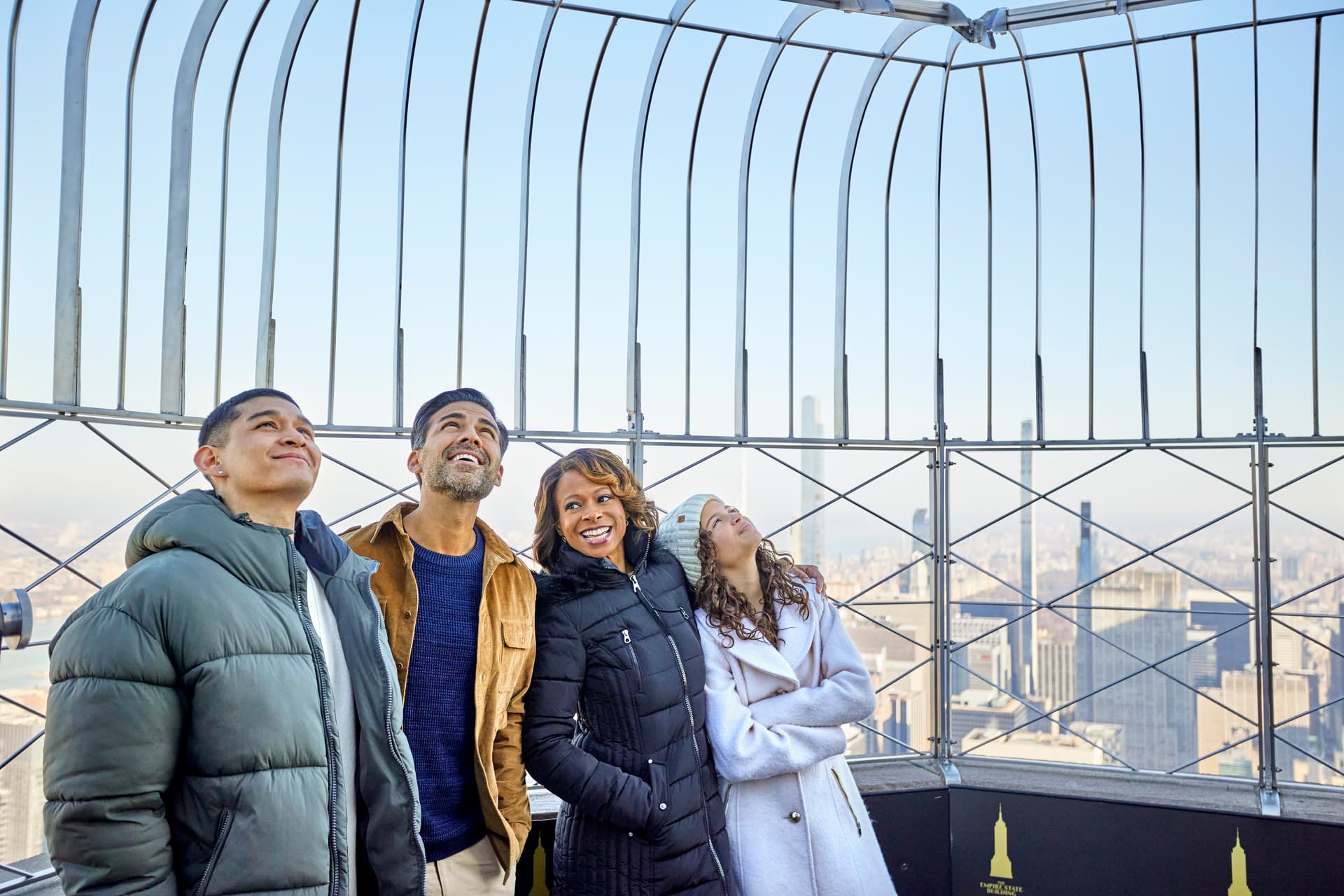 Family Smiling on 86th Floor Observatory