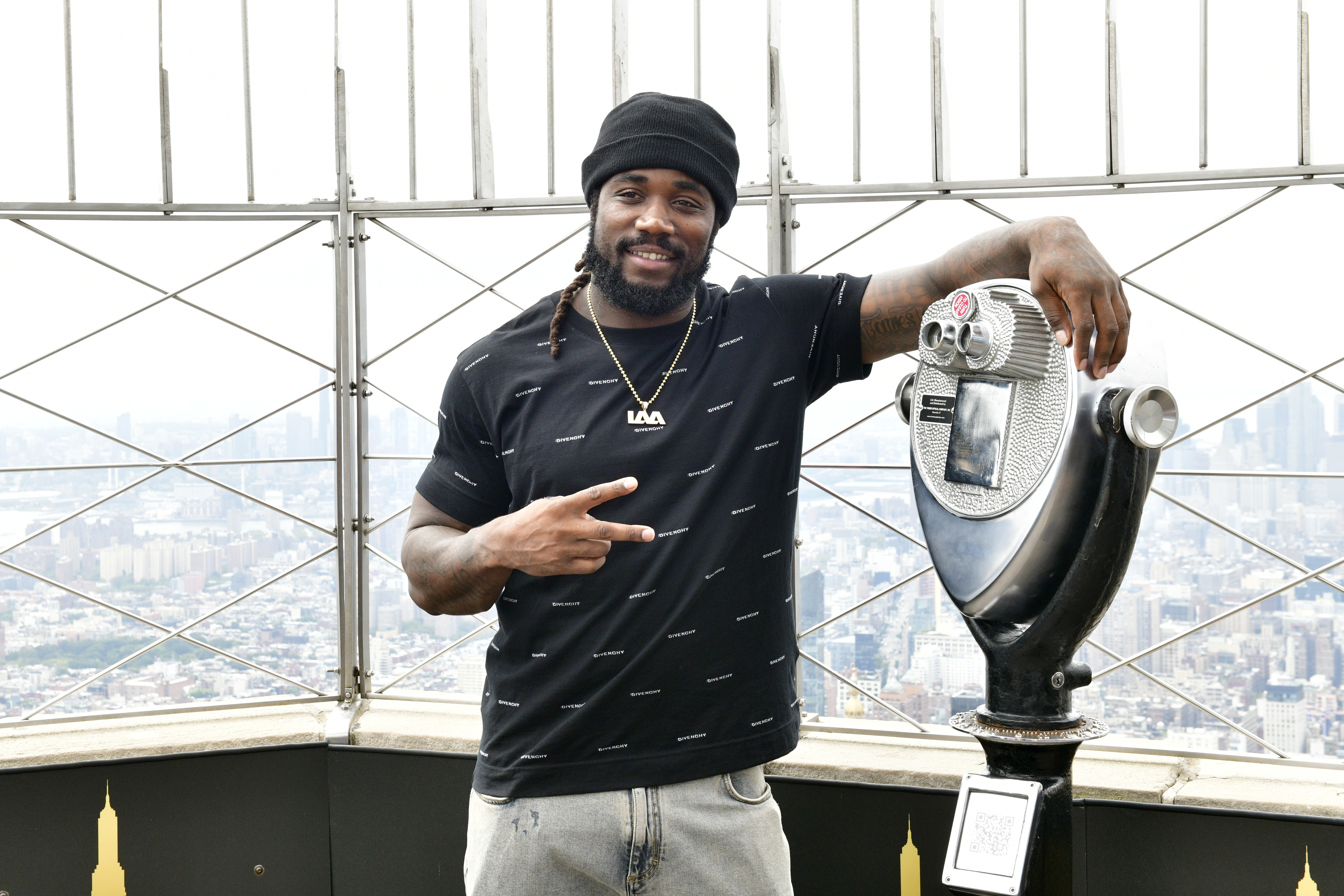 Dalvin Cook celebrates his New York Jets contract at the Empire State Building