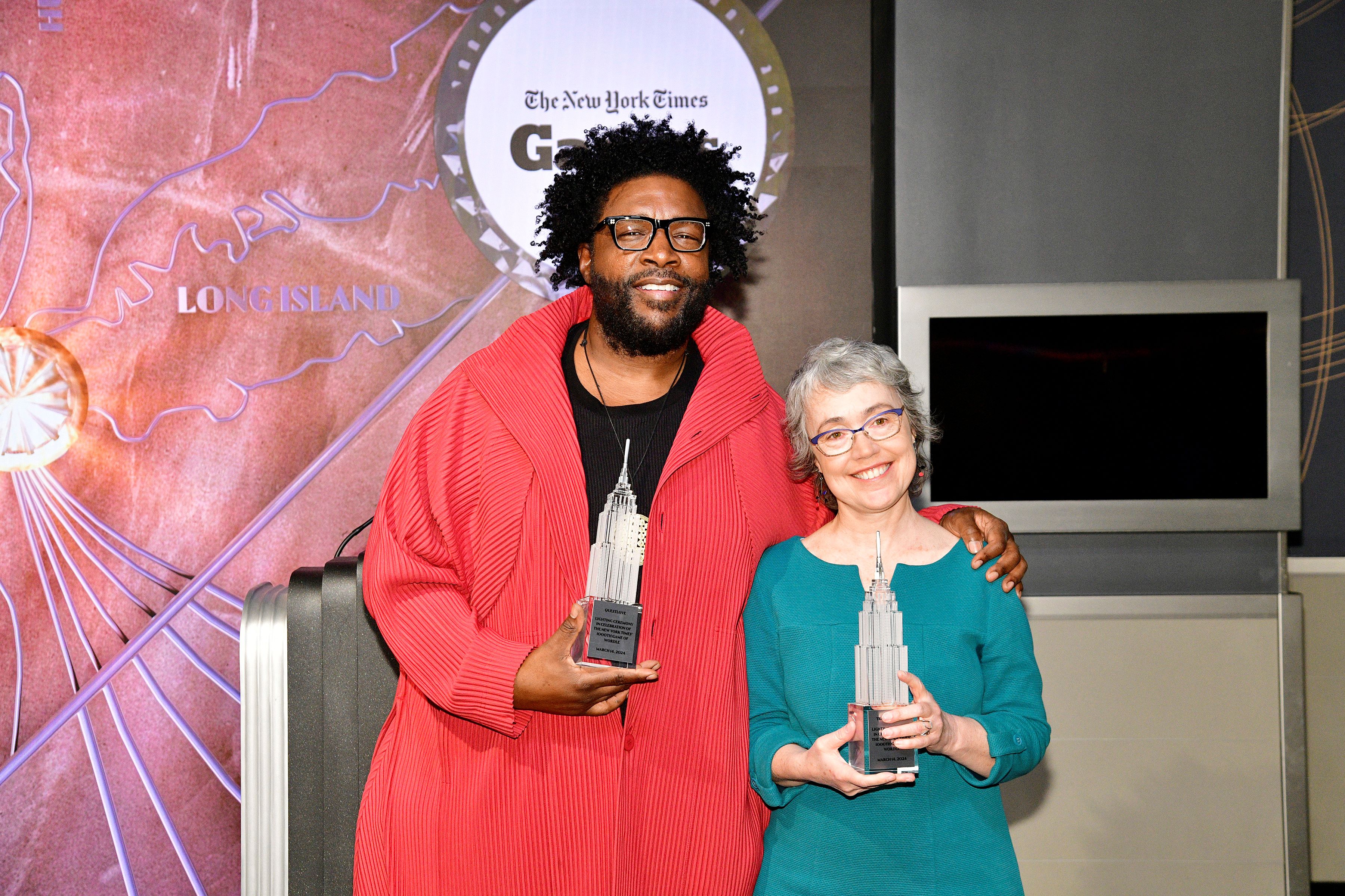 Questlove and Tracy Bennett hold their models at ESB.