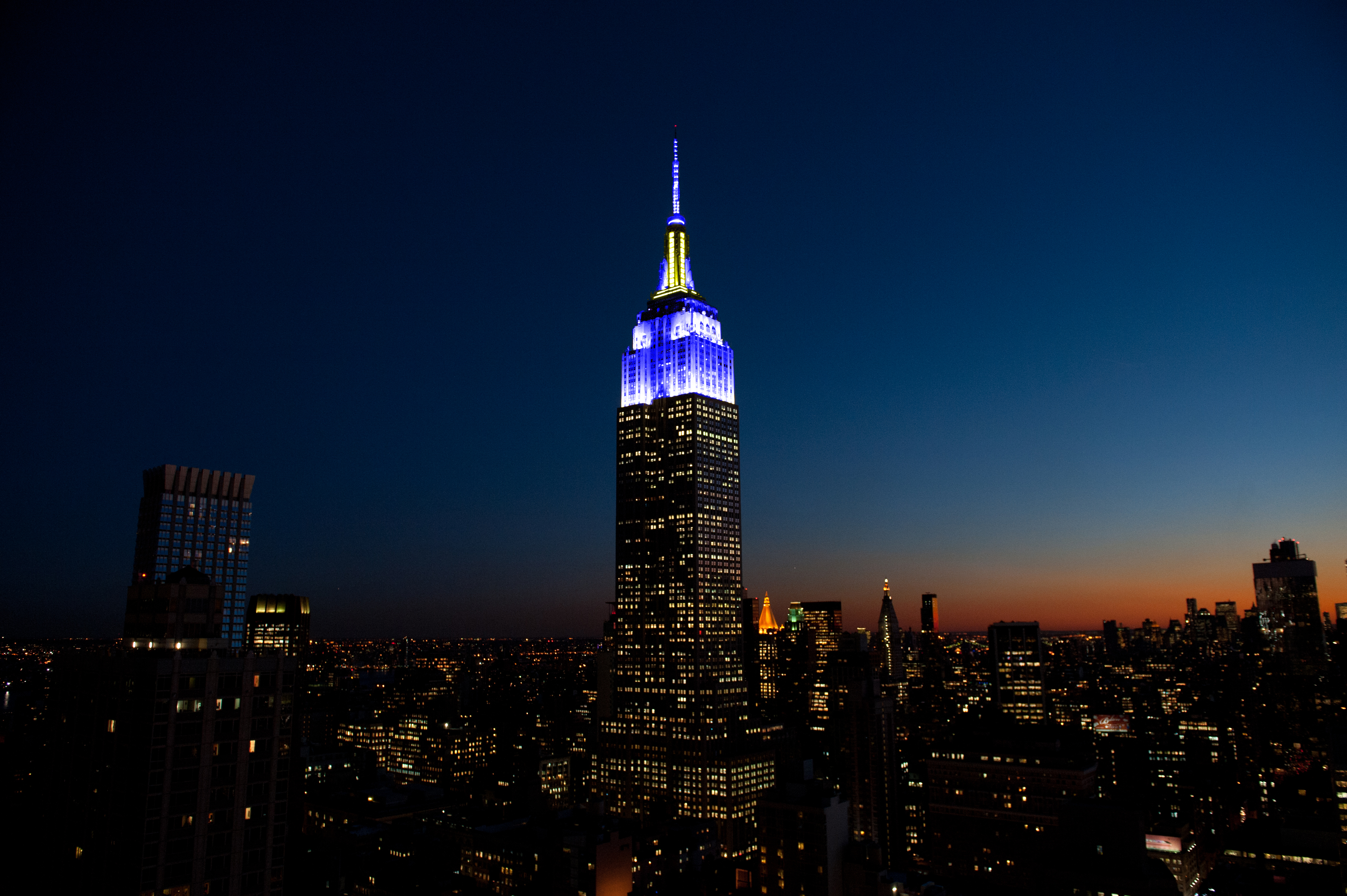 ESB lights in blue and yellow for Chuck Scarborough's 50th On-Air Anniversary
