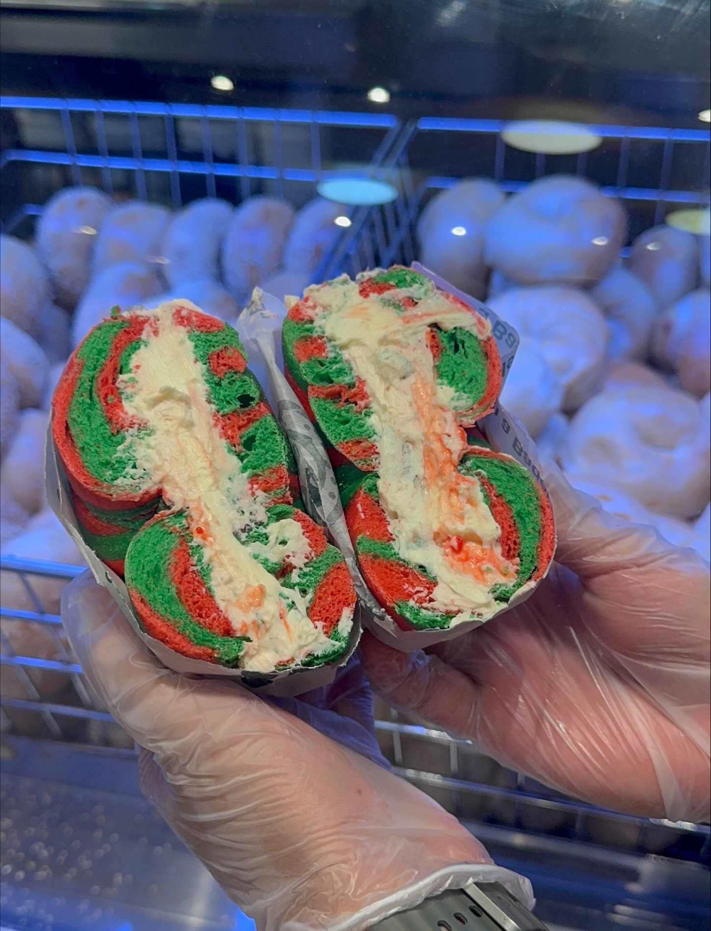 Essabagel brings holiday cheer at the empire state building with their red and green bagels with peppermint cream chese