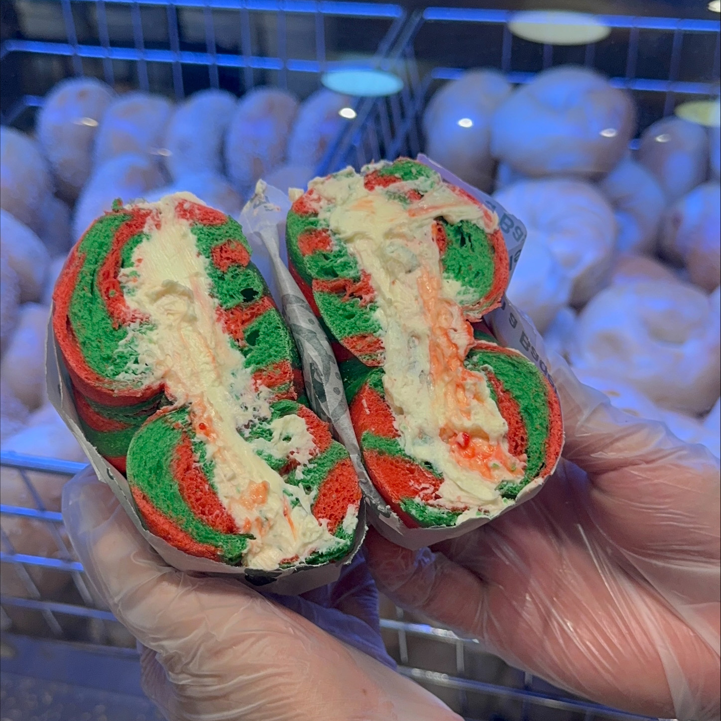 Essabagel brings holiday cheer at the empire state building with their red and green bagels with peppermint cream chese