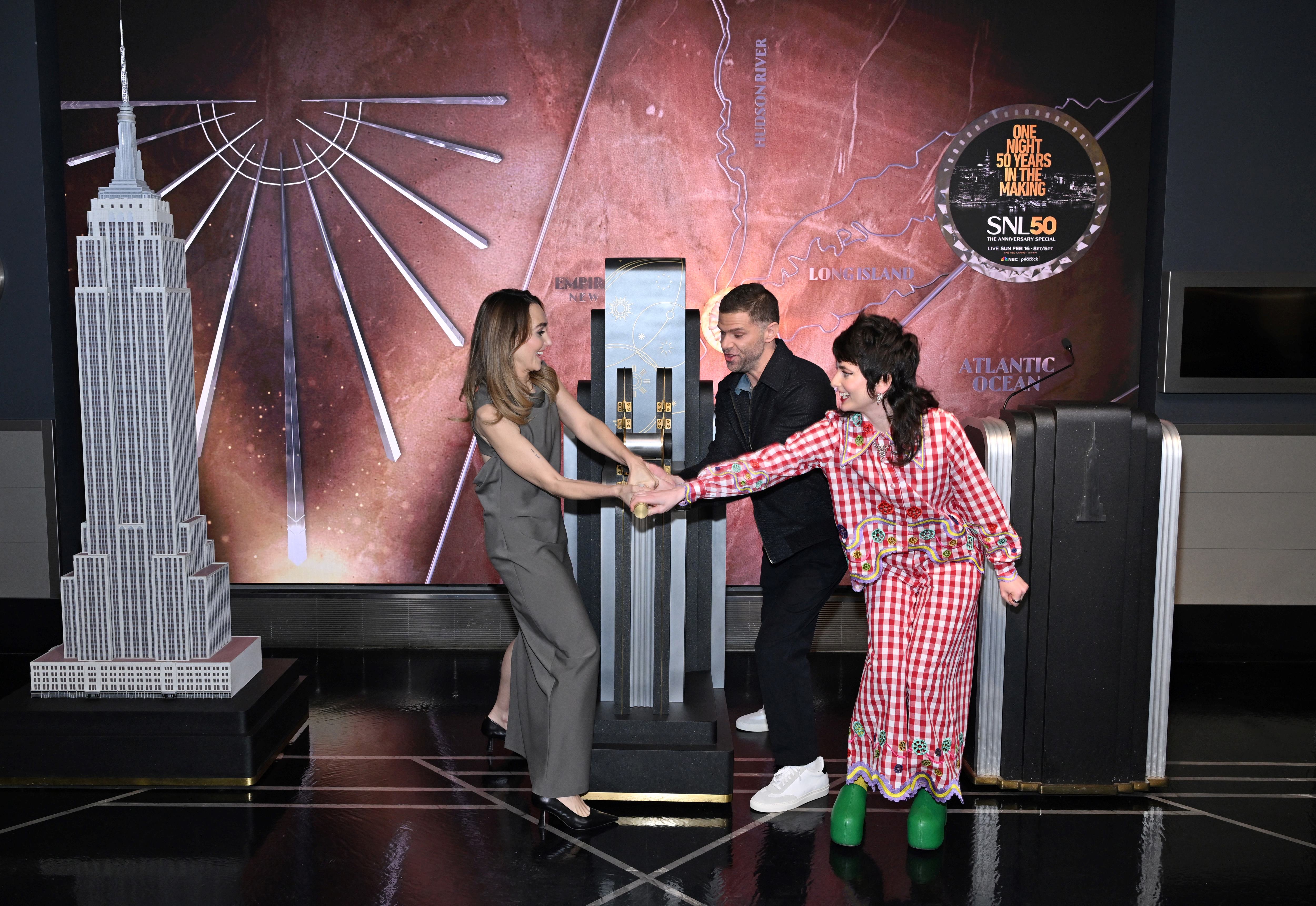 The cast of SNL flips the switch in a lighting ceremony