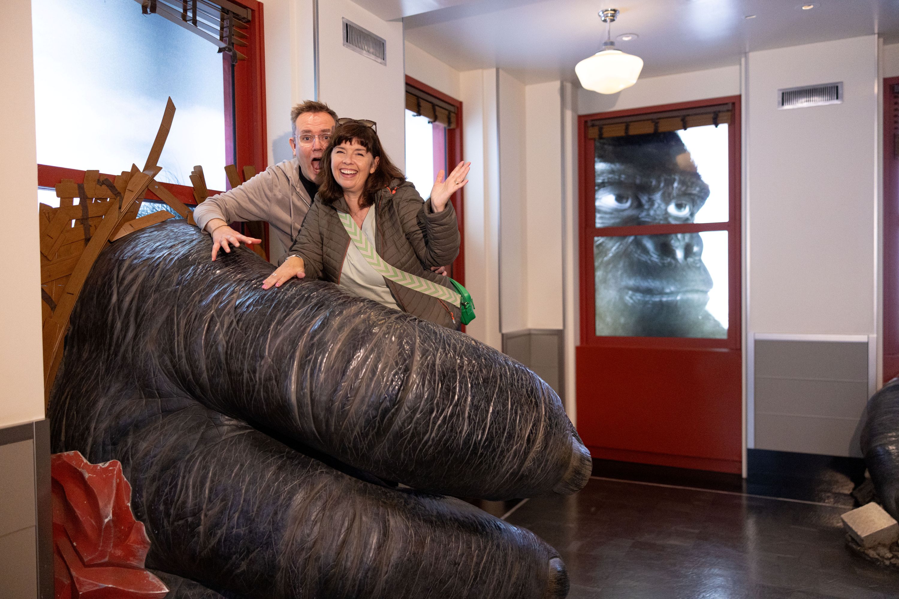 People experiencing the Kong exhibit in the Empire State Building Observatory museum experience.
