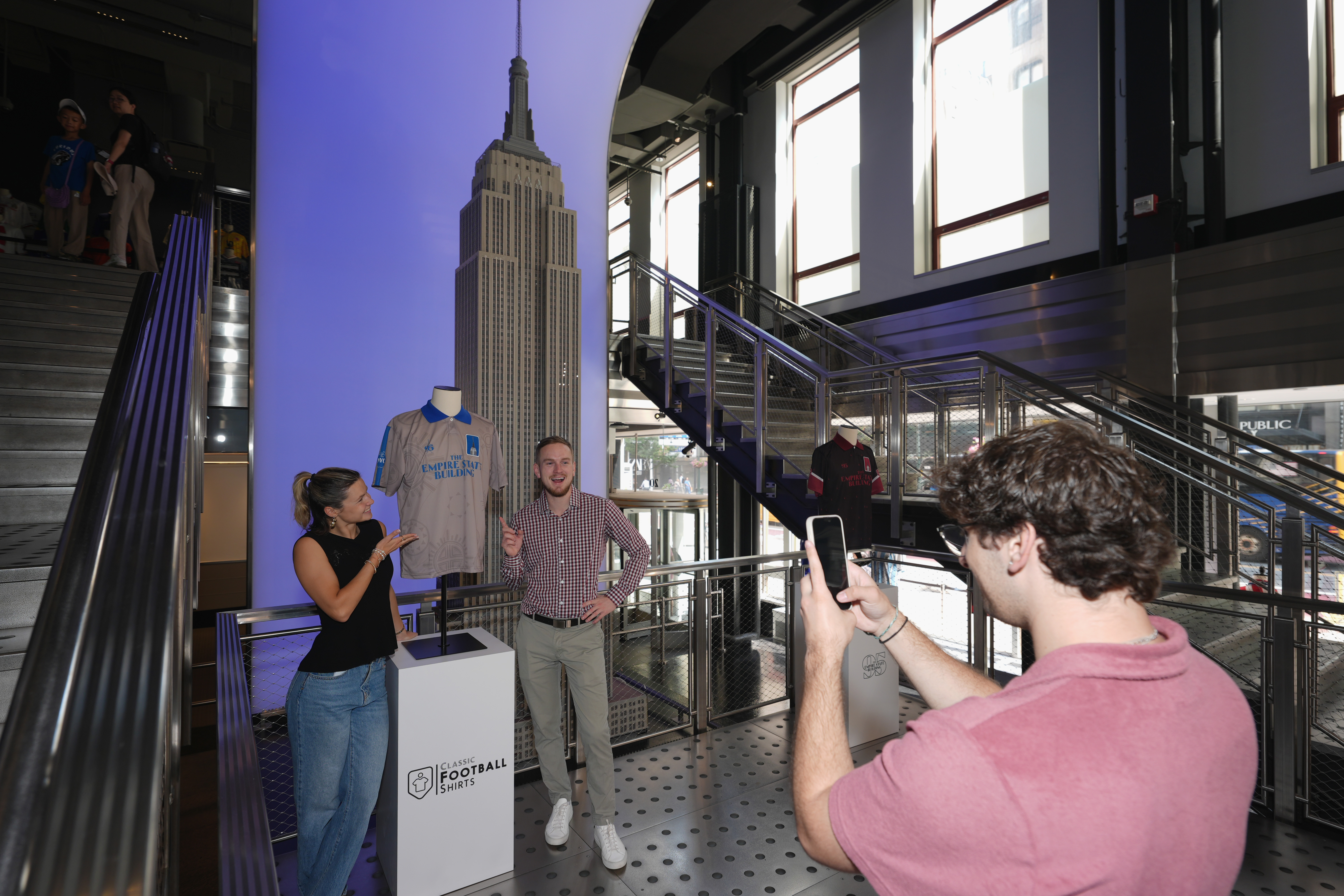 Guests pose with an ESB jersey