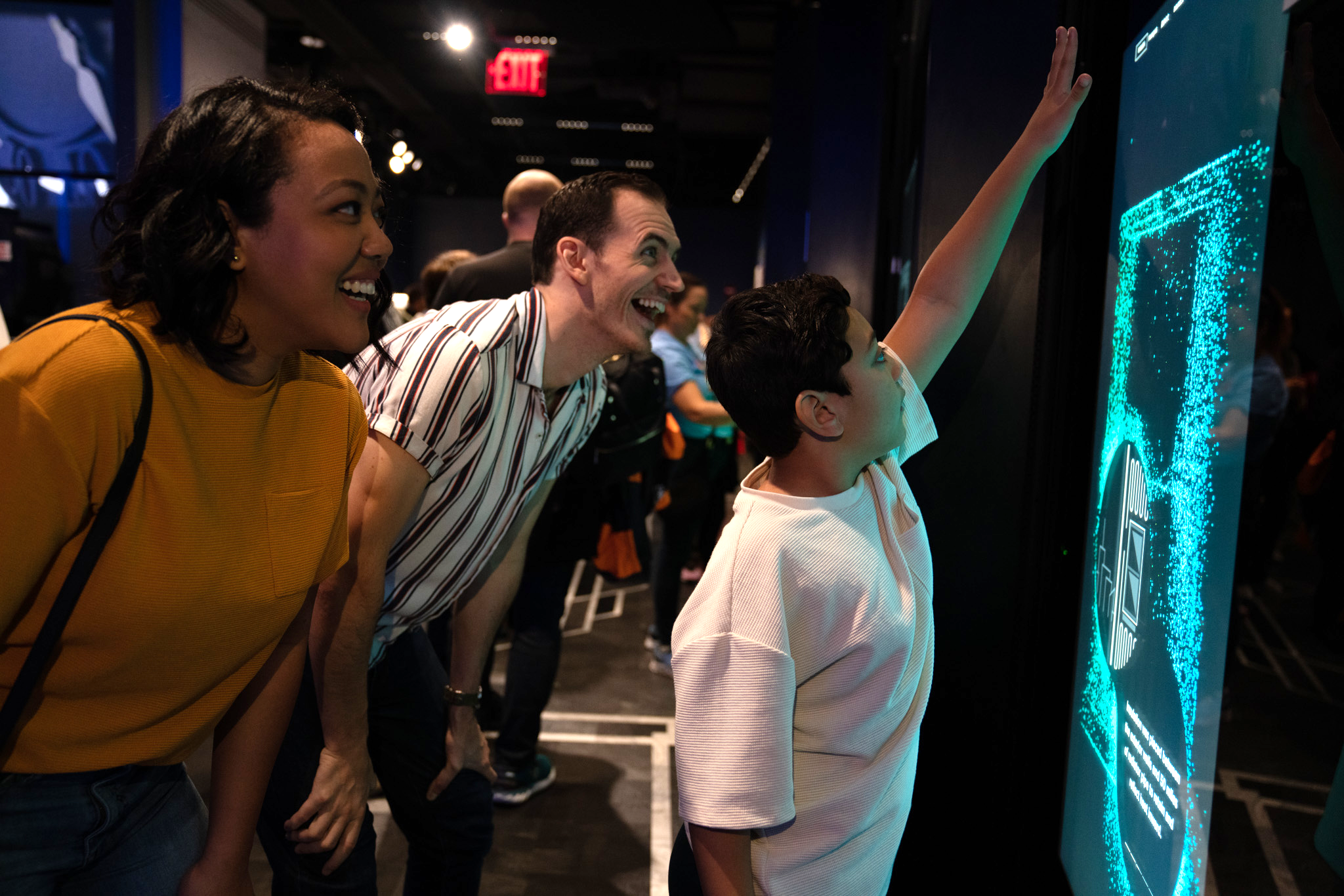 A family in the Observation Deck exhibits