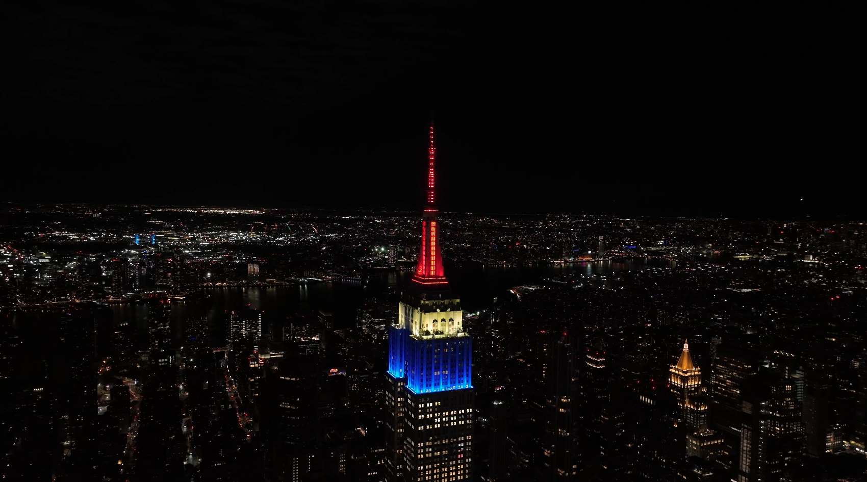 The Empire State Building lights in the French colors