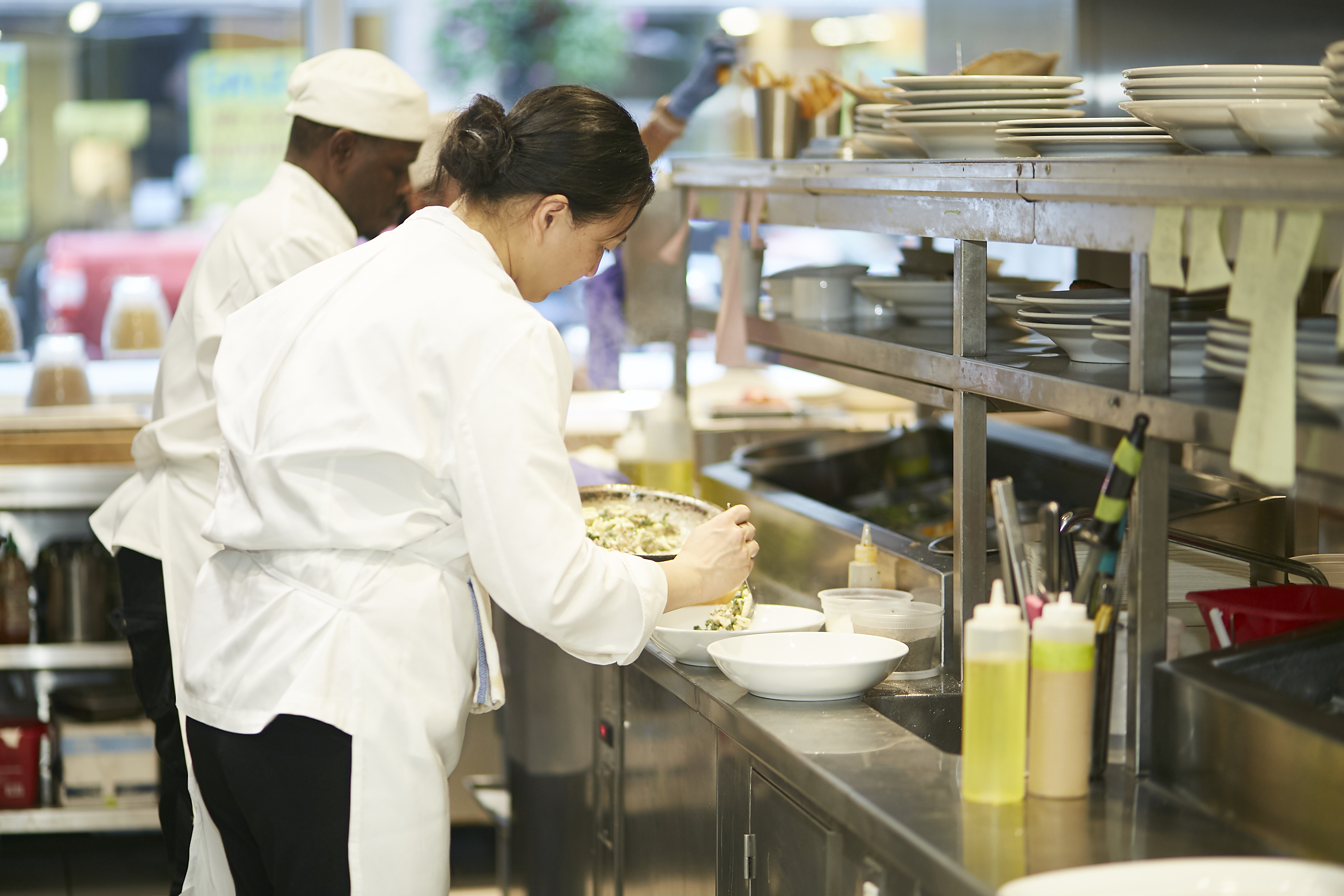 Chef plating food in a restaurant