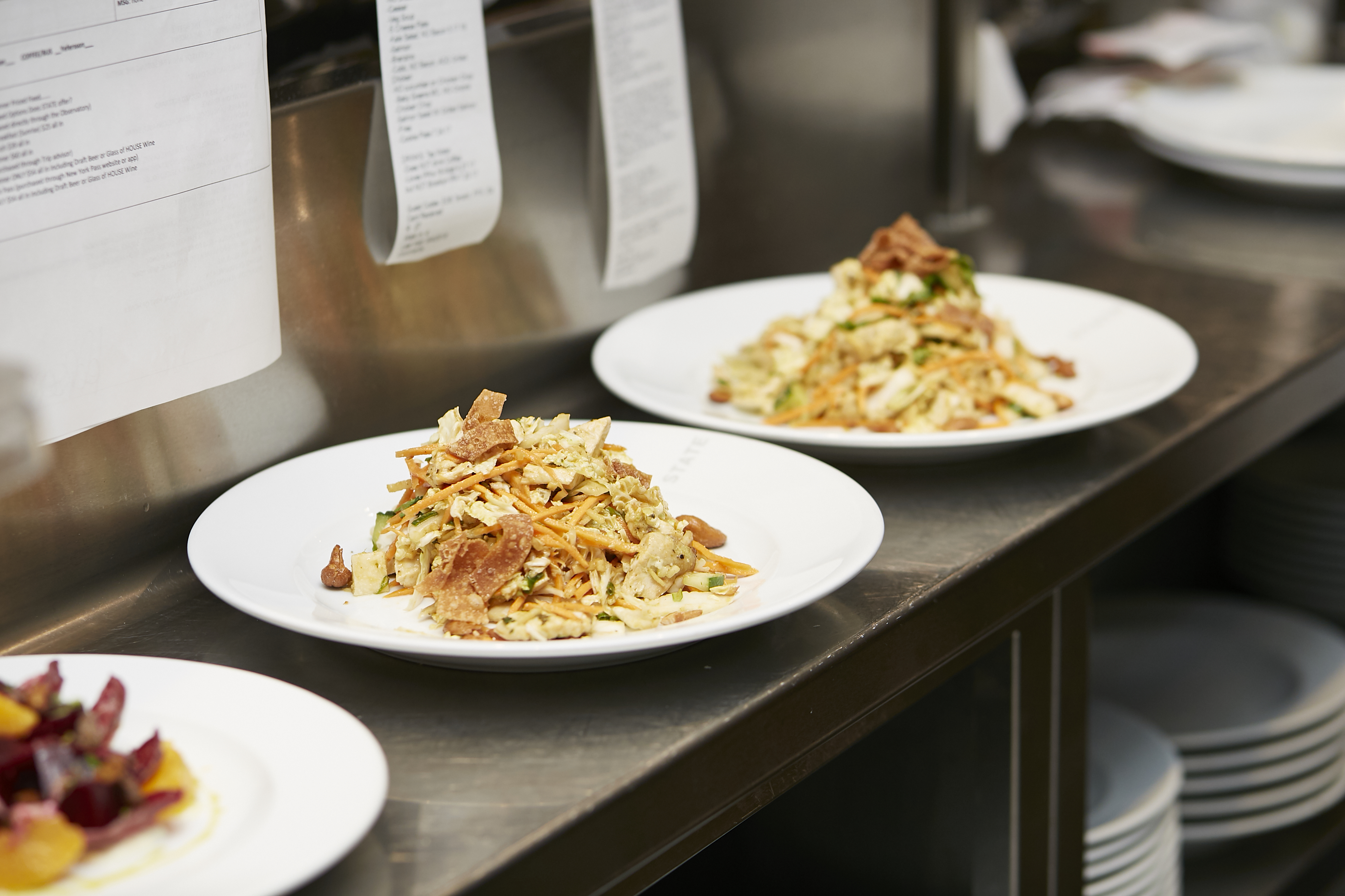 Food on an expo counter in a kitchen