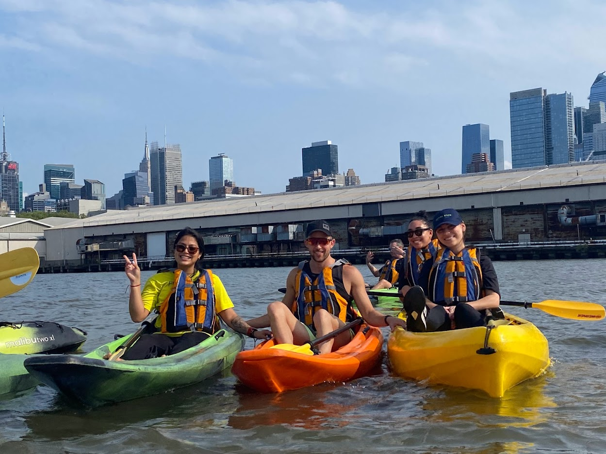 people kayaking on a river