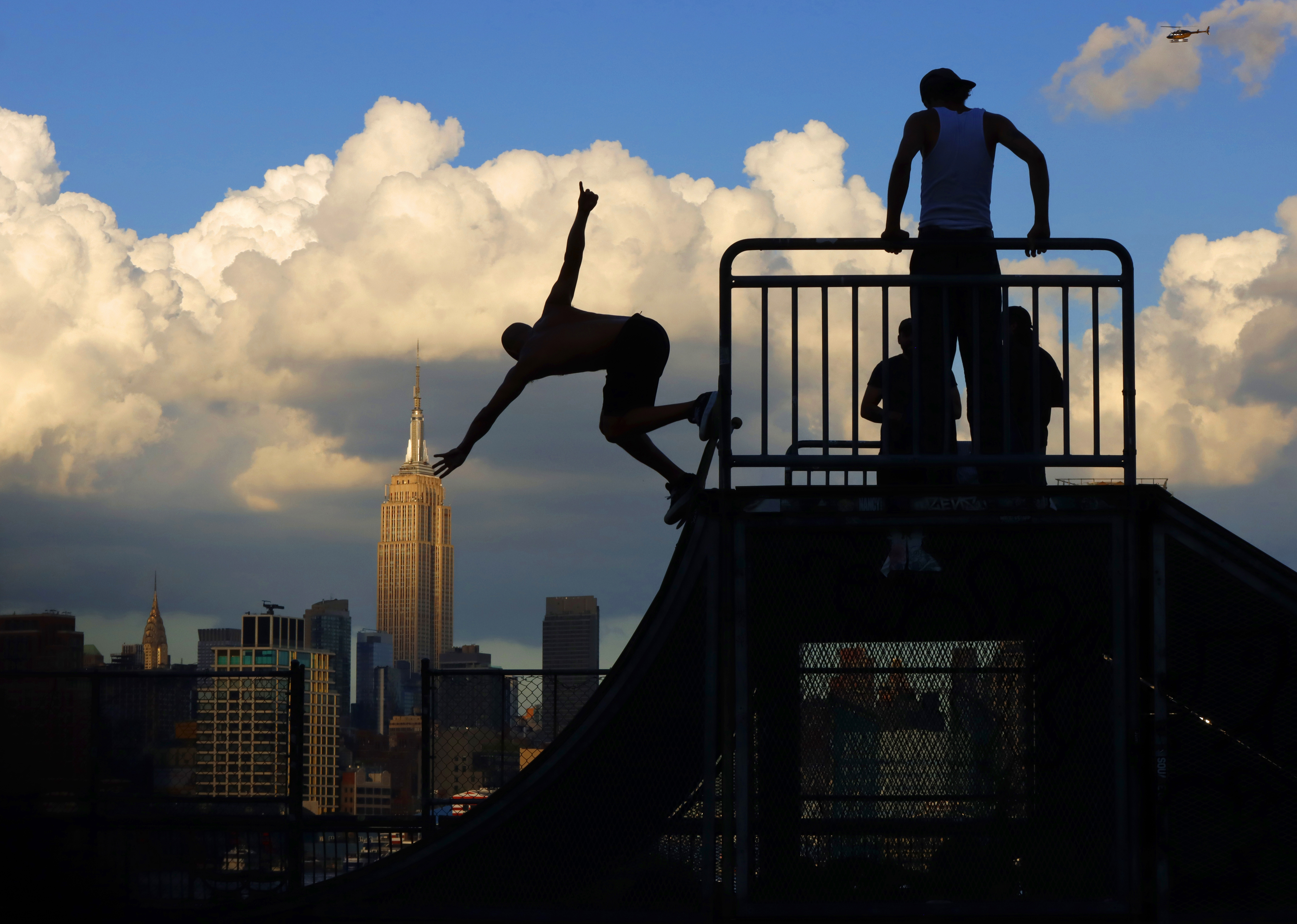 skateboarders with ESB in background
