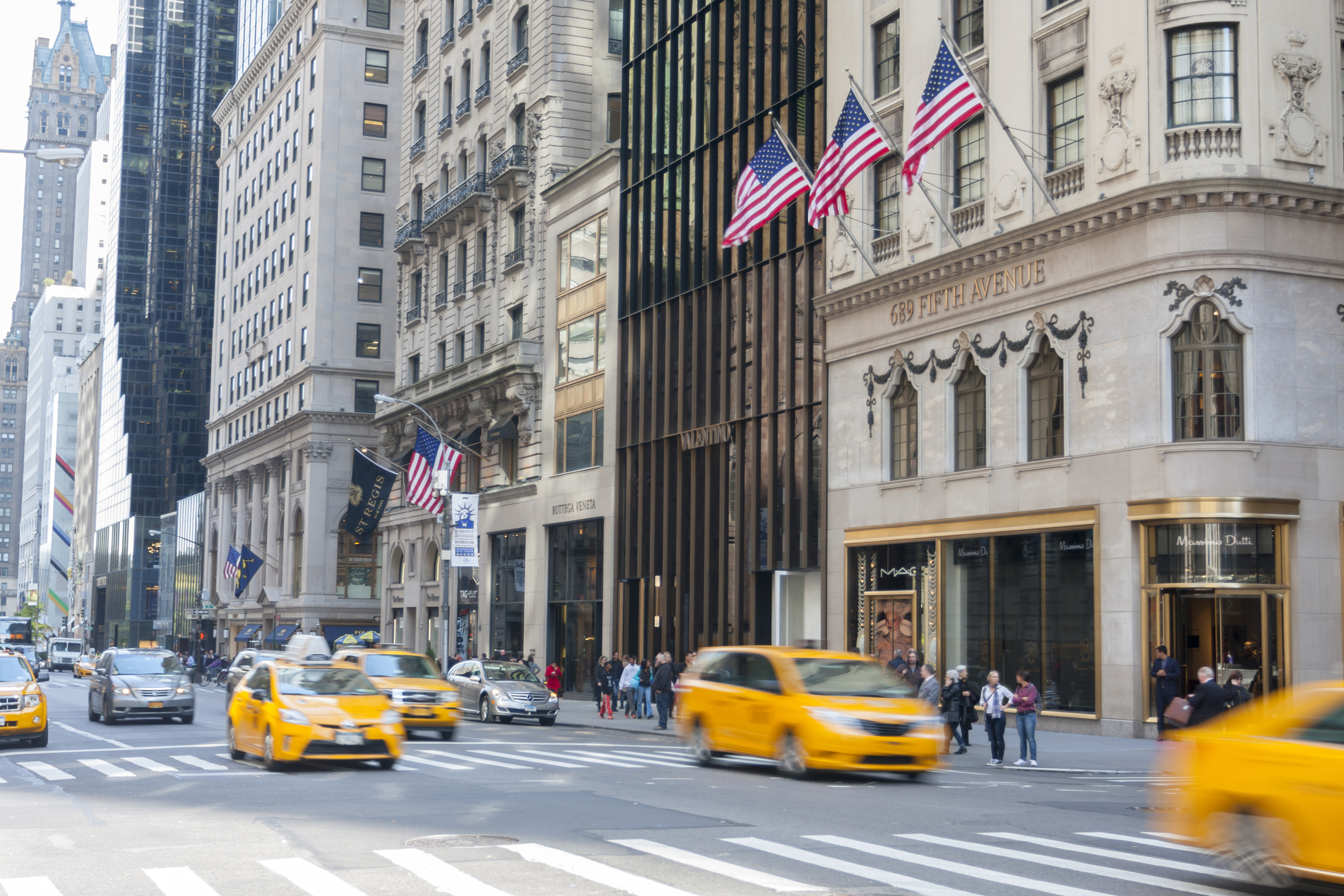 Cabs drive down New York's Fifth Avenue