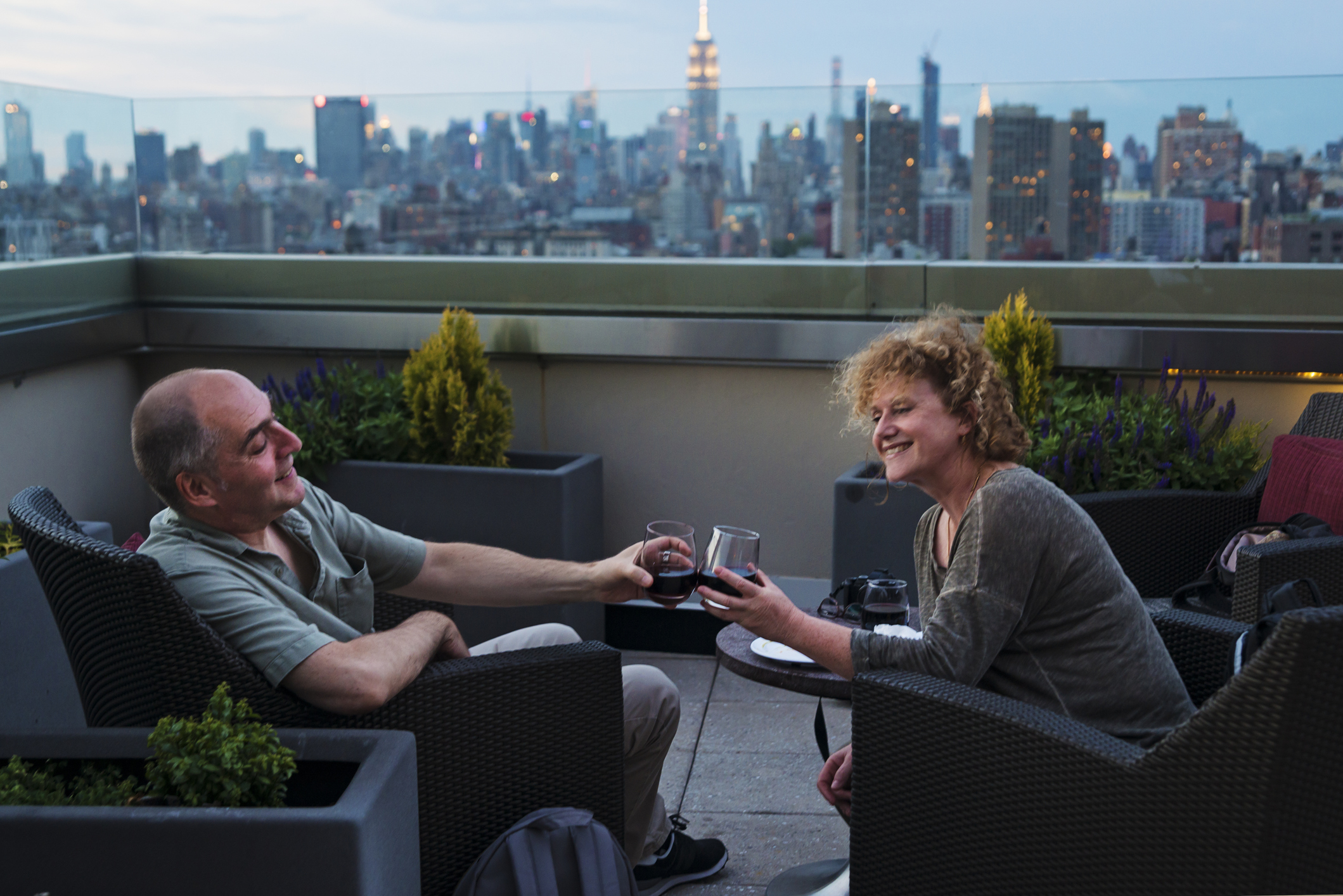 People toasting on a rooftop