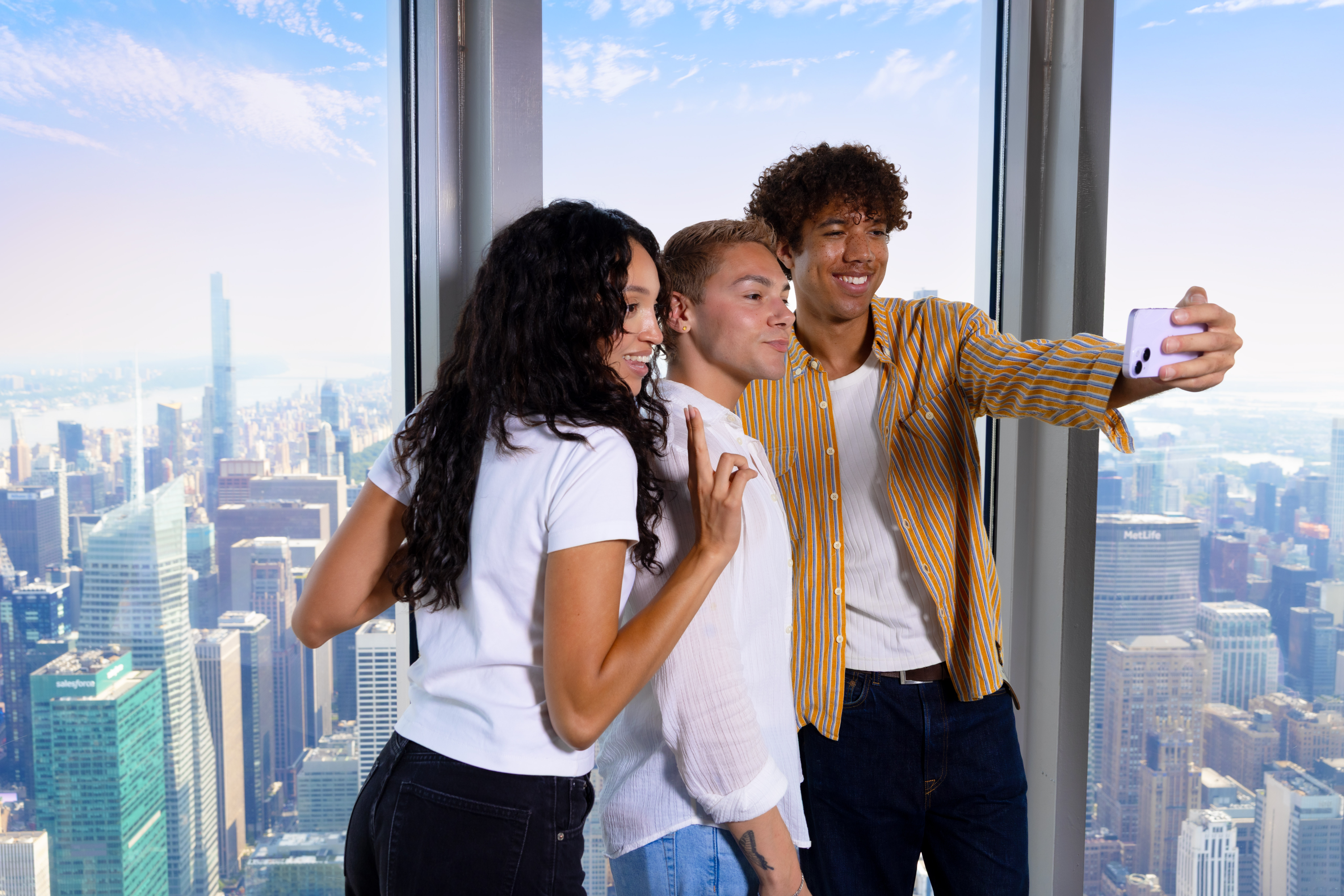 Three friends on the Empire State Building's 102nd Floor Observation Deck