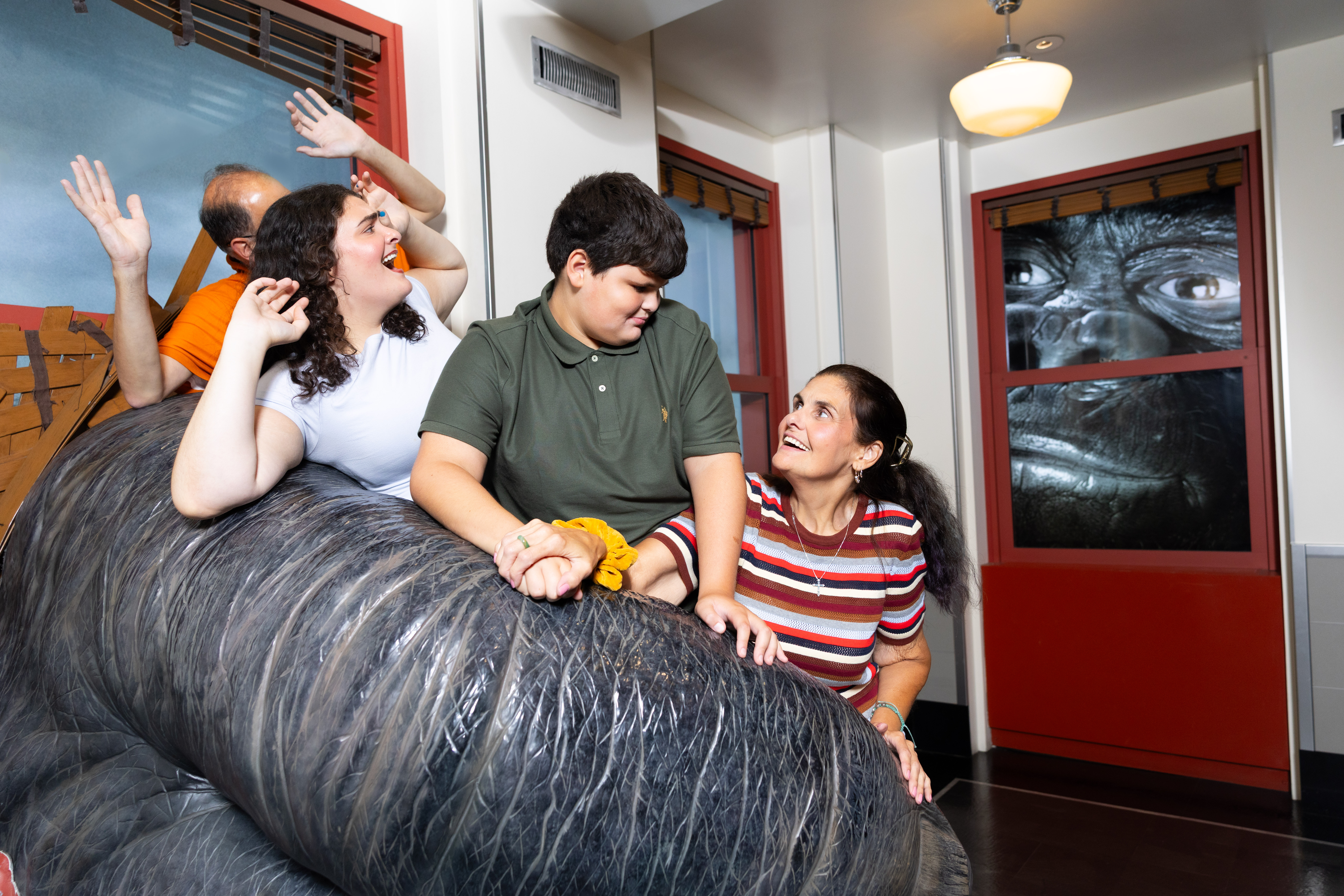 Family taking a photo at Kong at the Empire State Building Observation Deck experience