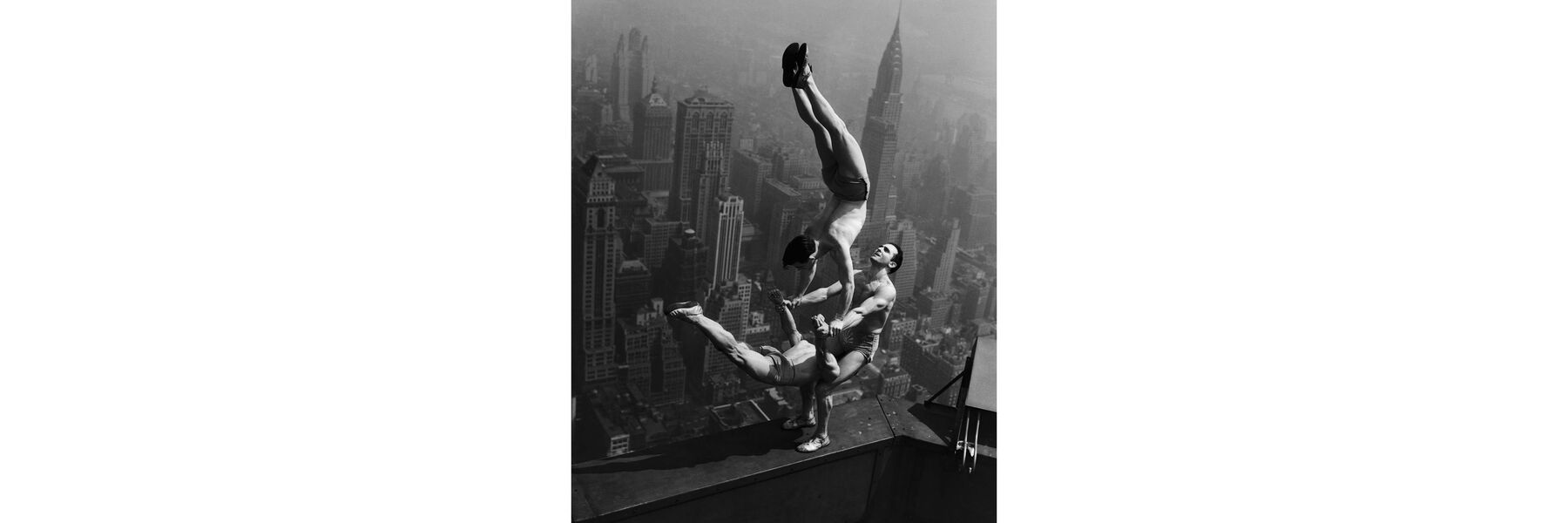 Acrobats balance on the top of ESB