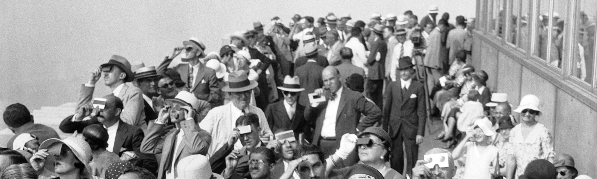 Archival photo of people viewing the solar eclipse from ESB
