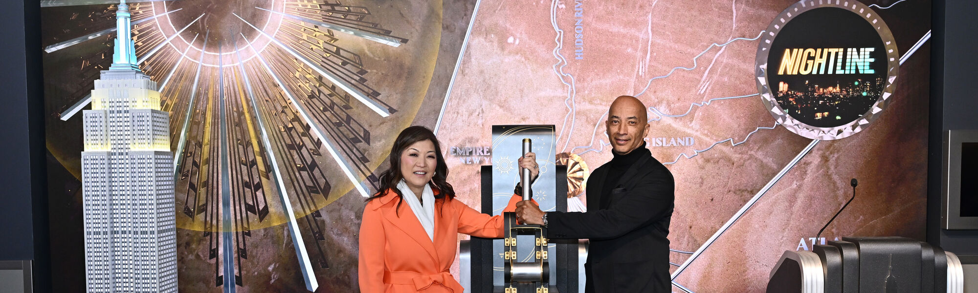 Juju Chang and Byron Pitts light the Empire State Building