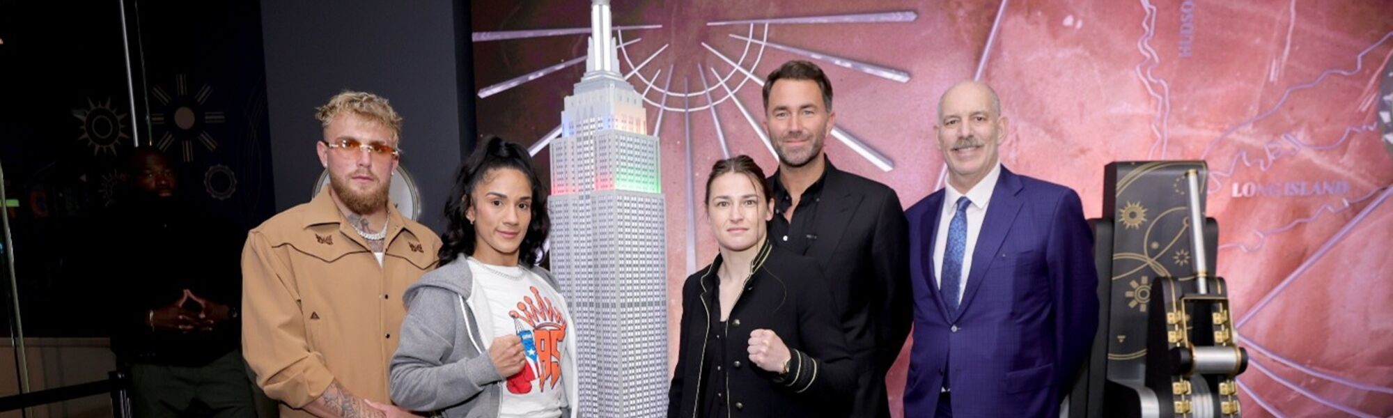 Katie Taylor, Amanda Serrano, Jake Paul pose for a picture at the Empire State Building lighting ceremony
