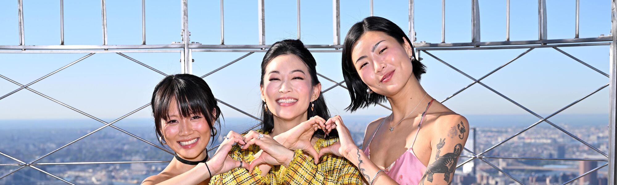 Arden Cho, May Hong, and REI AMI on the 86th Floor Observatory
