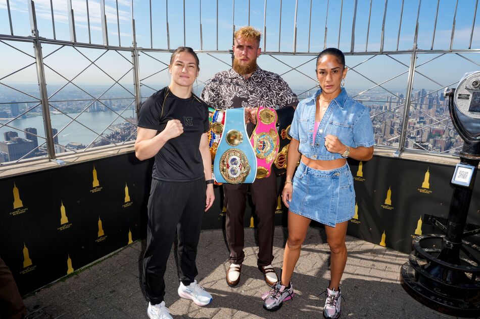 Katie Taylor and Amanda Serrano with Jake Paul on the 86th Floor Observatory