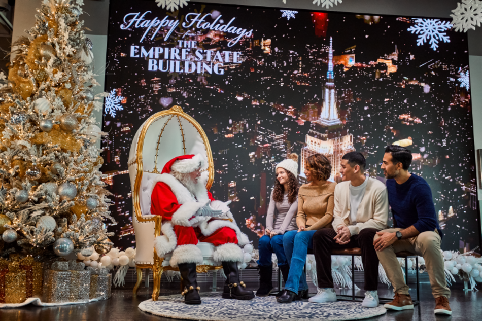 A family meeting Santa at the Empire State Building Observatory on the 86th Floor.
