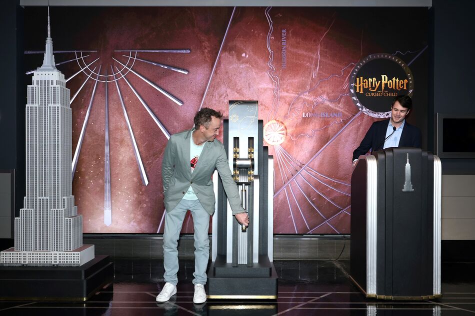 Tom Felton flips the switch to light the Empire State Building