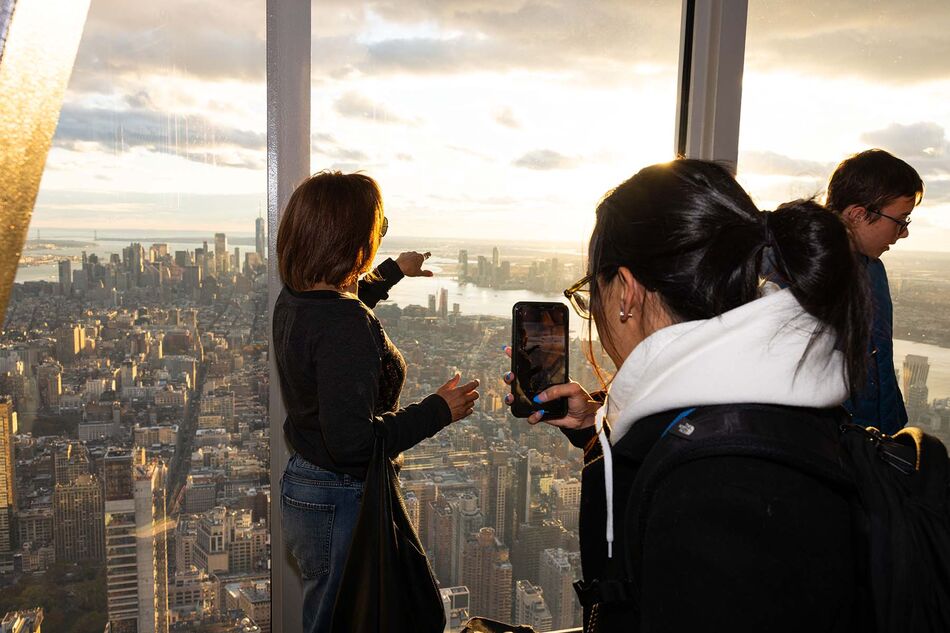 People taking photo on the Empire State Building 102nd Floor Observatory, NYC's best vista point