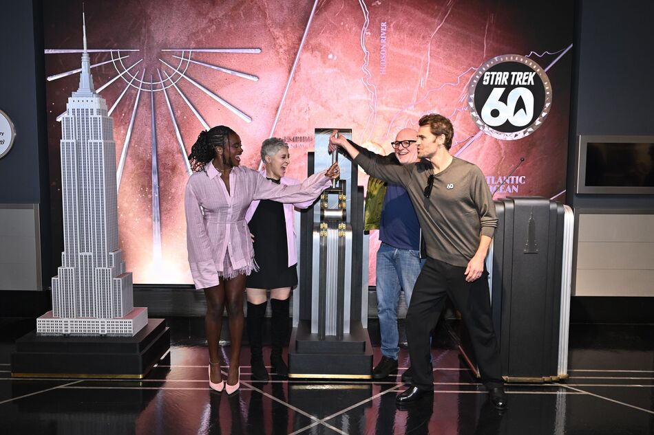 Paul Wesley, Celia Rose Gooding, Melissa Navia, and Akiva Goldsman light the Empire State Building
