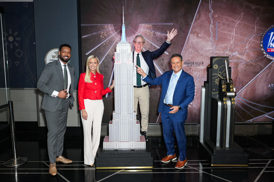 Steve Doocy, Ainsley Earhardt, Brian Kilmeade and Lawrence Jones light the Empire State Building