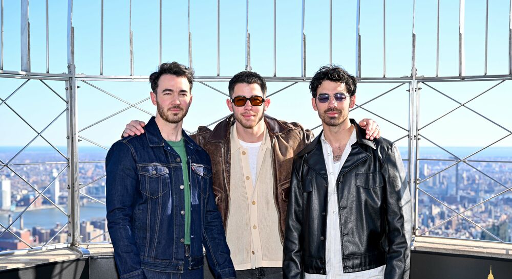 The Jonas Brothers on the 86th Floor Observatory