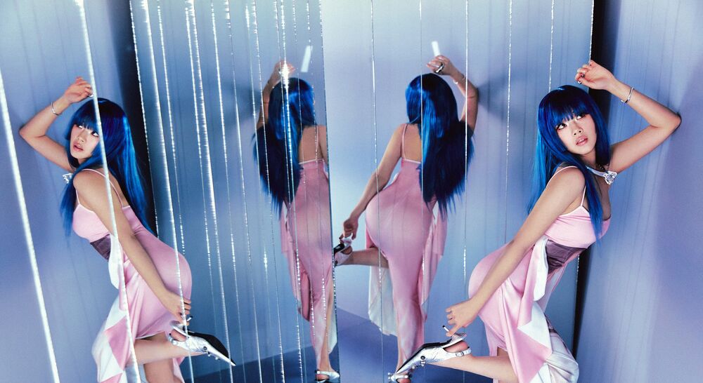 BIBI poses in mirrors for her new album, Eve: Romance